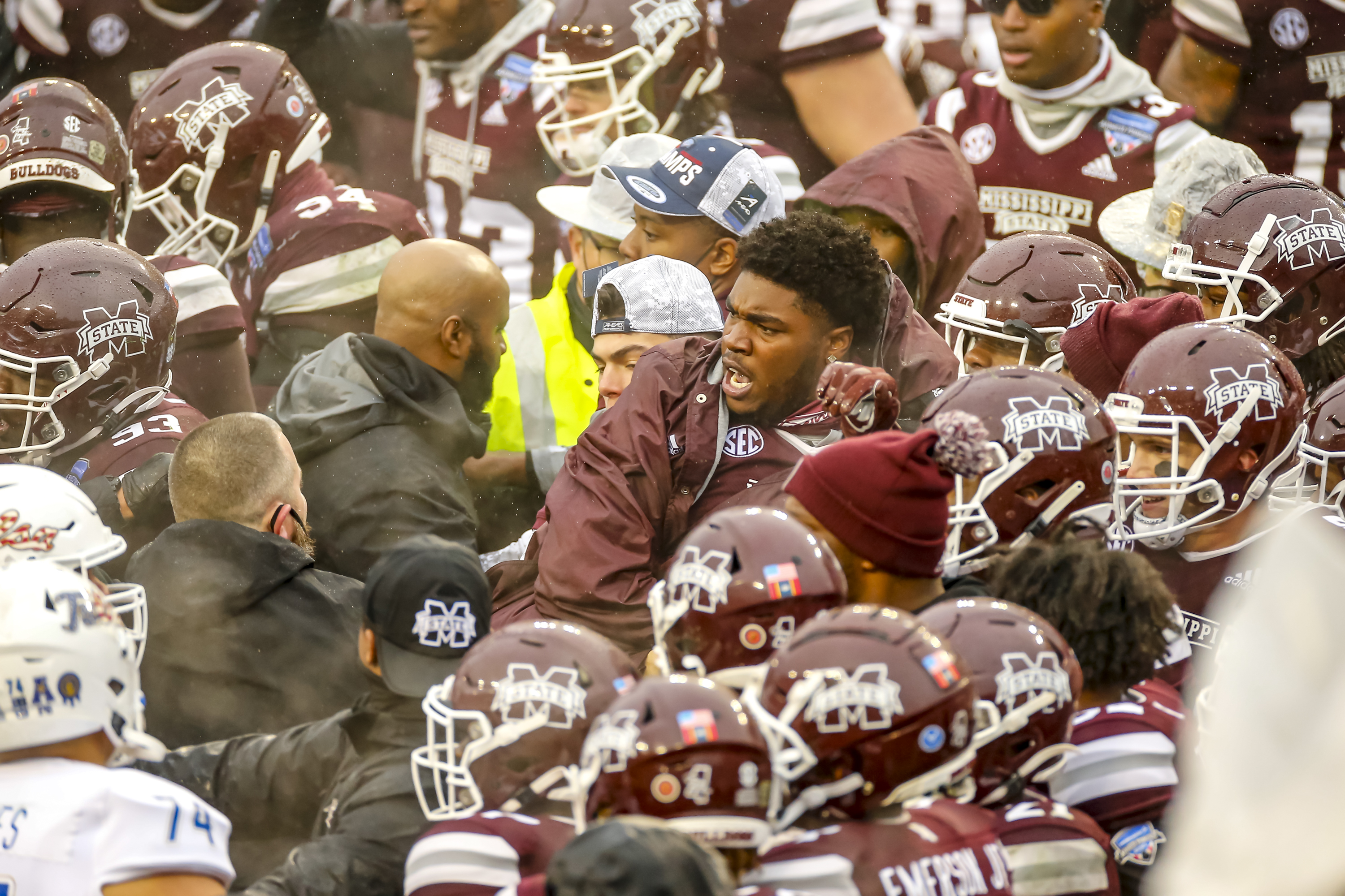 A fight breaks out after the Armed Forces Bowl game.