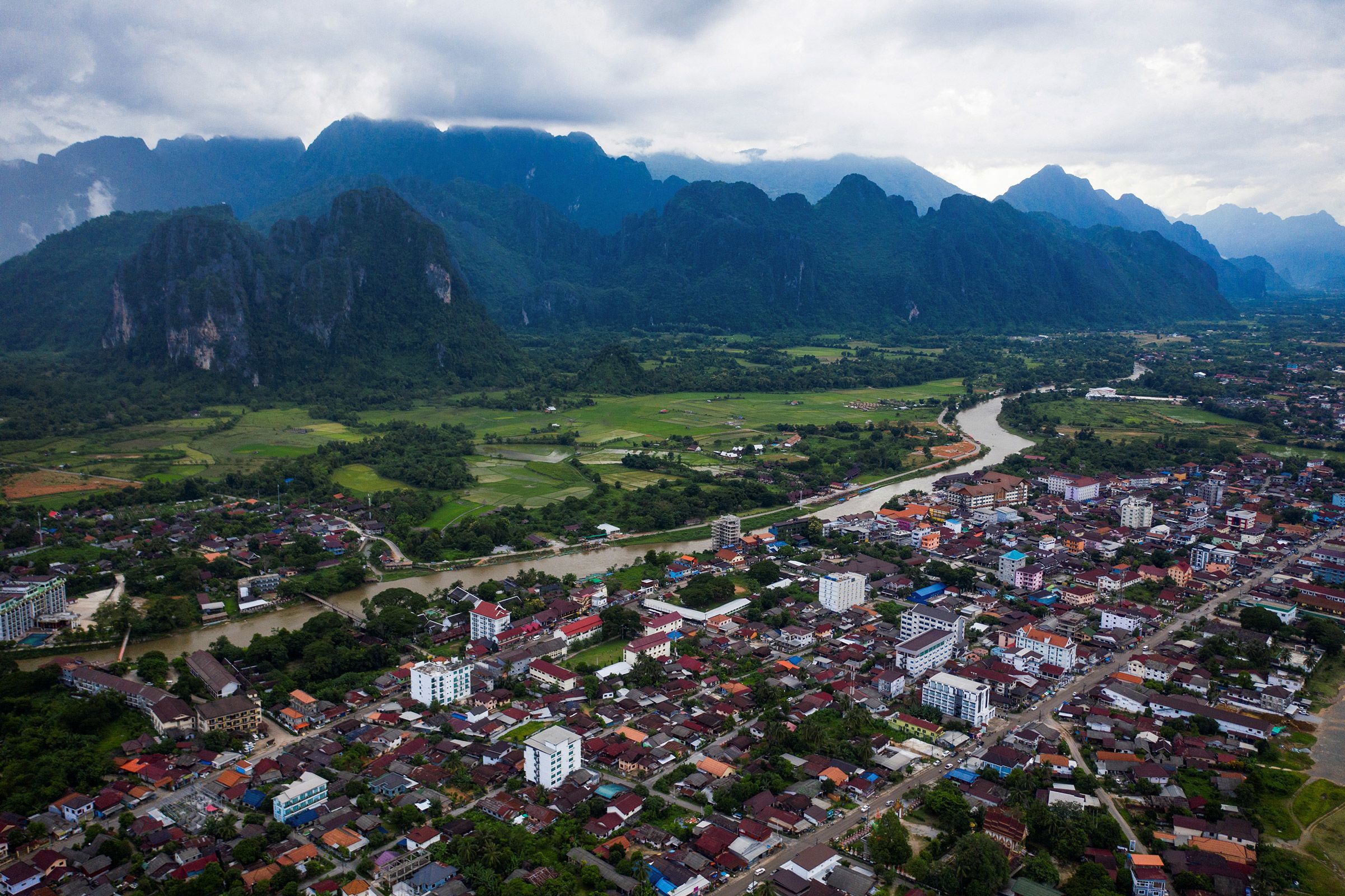 The deaths of six foreign tourists linked to a suspected mass methanol poisoning has thrown a spotlight on a small town in Southeast Asia that has worked hard in recent years to shed its reputation for excess.