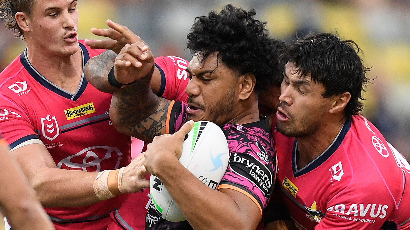  Thomas Mikaele of the Tigers is tackled during the round 22 NRL match between the North Queensland Cowboys and the Wests Tigers at QCB Stadium, on August 14, 2021, in Townsville, Australia. (Photo by Ian Hitchcock/Getty Images)