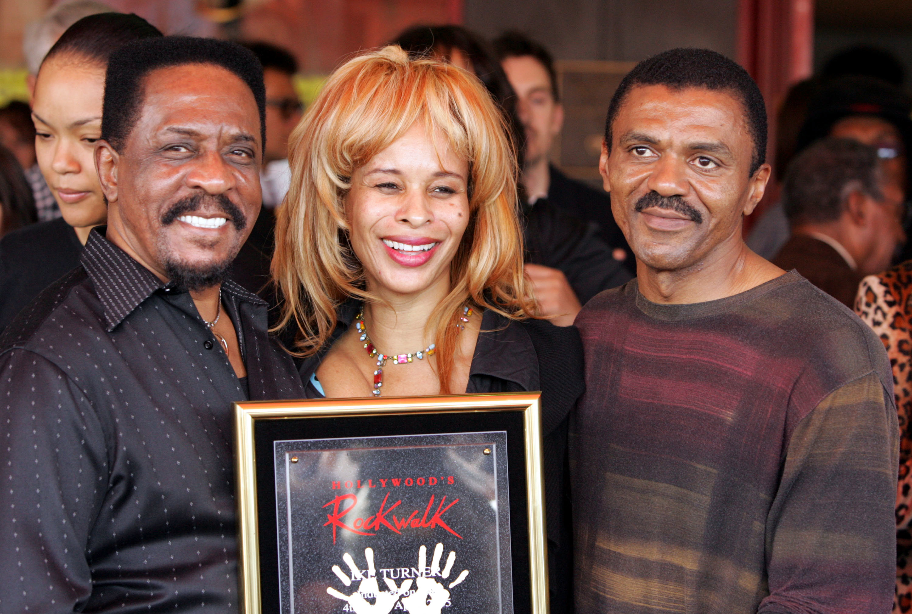 HOLLYWOOD, CA - APRIL 4: Musician Ike Turner with guest Audrey Madison and Ike Turner Jr. pose after Ike was Inducted into the Hollywood Rockwalk along with Muddy Waters, Robert Cray, Solomon Burke and Etta James on April 4, 2005 in Hollywood, California. (Photo by Frazer Harrison/Getty Images) *** Local Caption *** Ike Turner;Audrey Madison;Ike Turner Jr