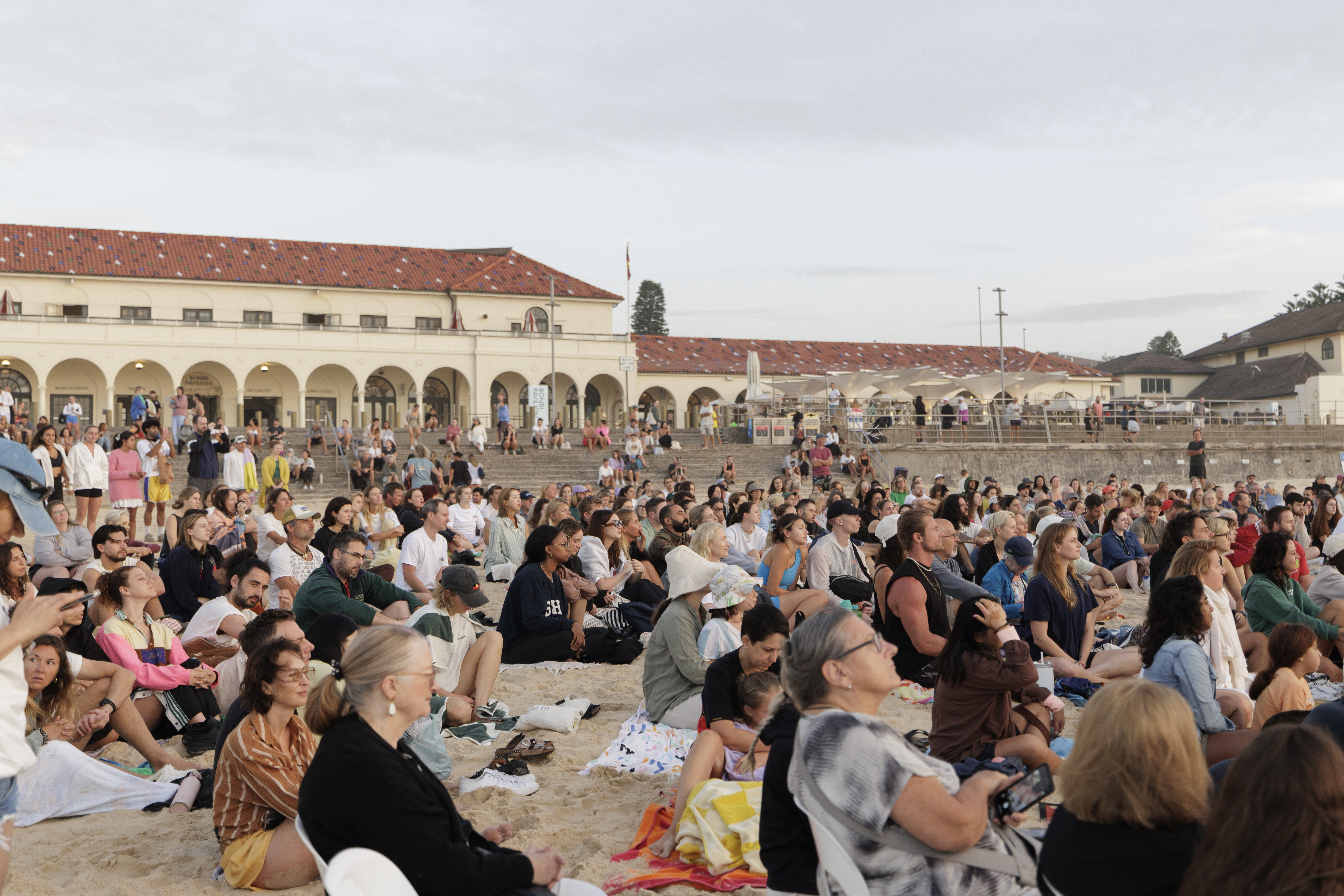 People gather for a 'Dawn Reflection' on Bondi Beach on January 26, 2025 in Sydney, Australia. 