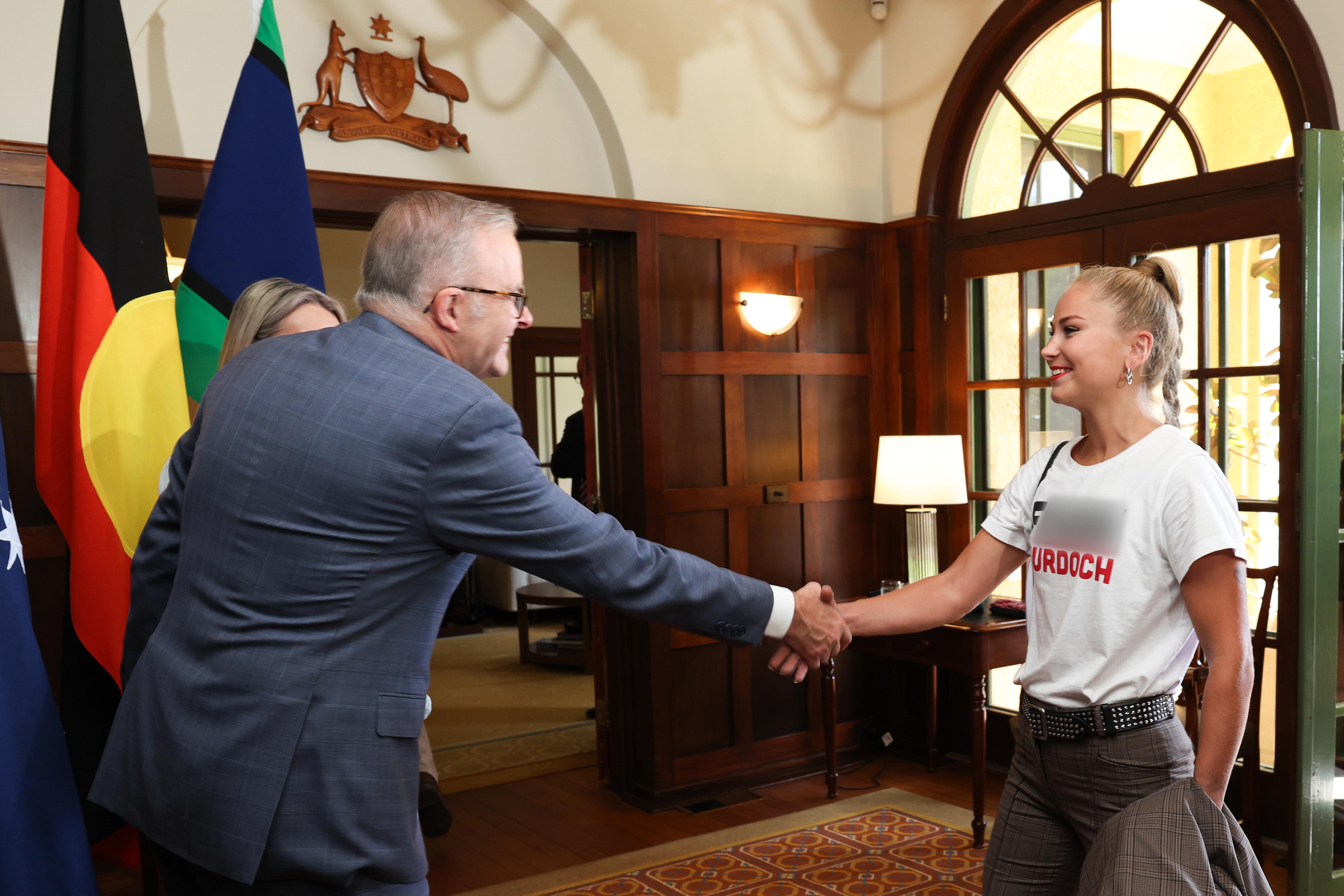 Prime Minister Anthony Albanese and Jodie Haydon greet 2021 Australian of the Year Grace Tame during arrivals for a 2025 Australian of the Year Awards morning tea at the Lodge in Canberra on Saturday 25 January 2025. fedpol Photo: Alex Ellinghausen