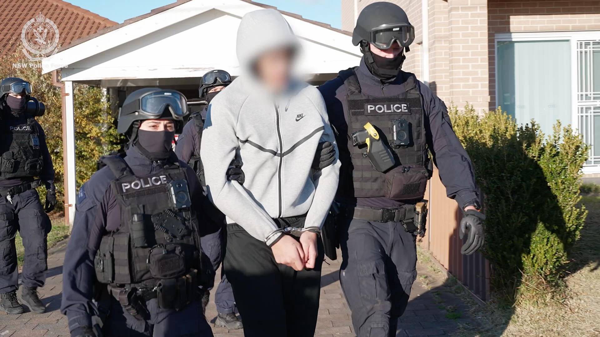 An 18-year-old has been arrested after a brazen stabbing attack that ended with the victim hiding inside a Kmart at a shopping centre in Sydney's west. 