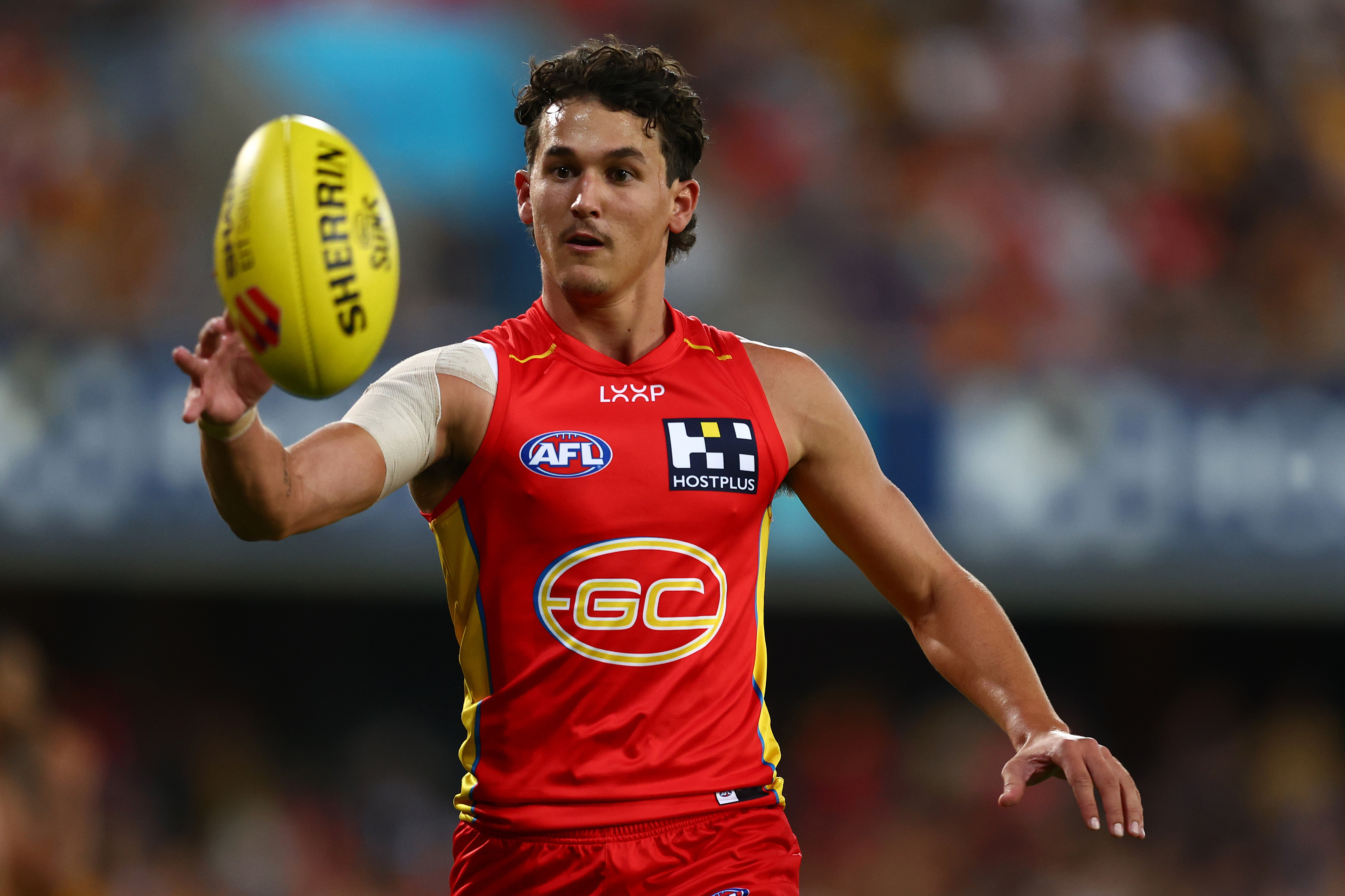Wil Powell of the Suns warms up during the round five AFL match between Gold Coast Suns and Hawthorn Hawks at People First Stadium, on April 13, 2024, in Gold Coast, Australia. (Photo by Chris Hyde/Getty Images)