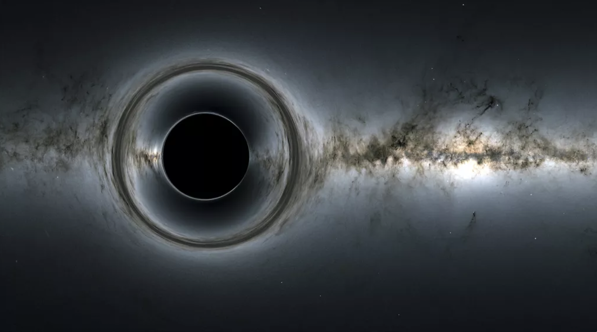 This NASA illustration depicts a solitary black hole in space, with its gravity warping the view of stars and galaxies in the background.