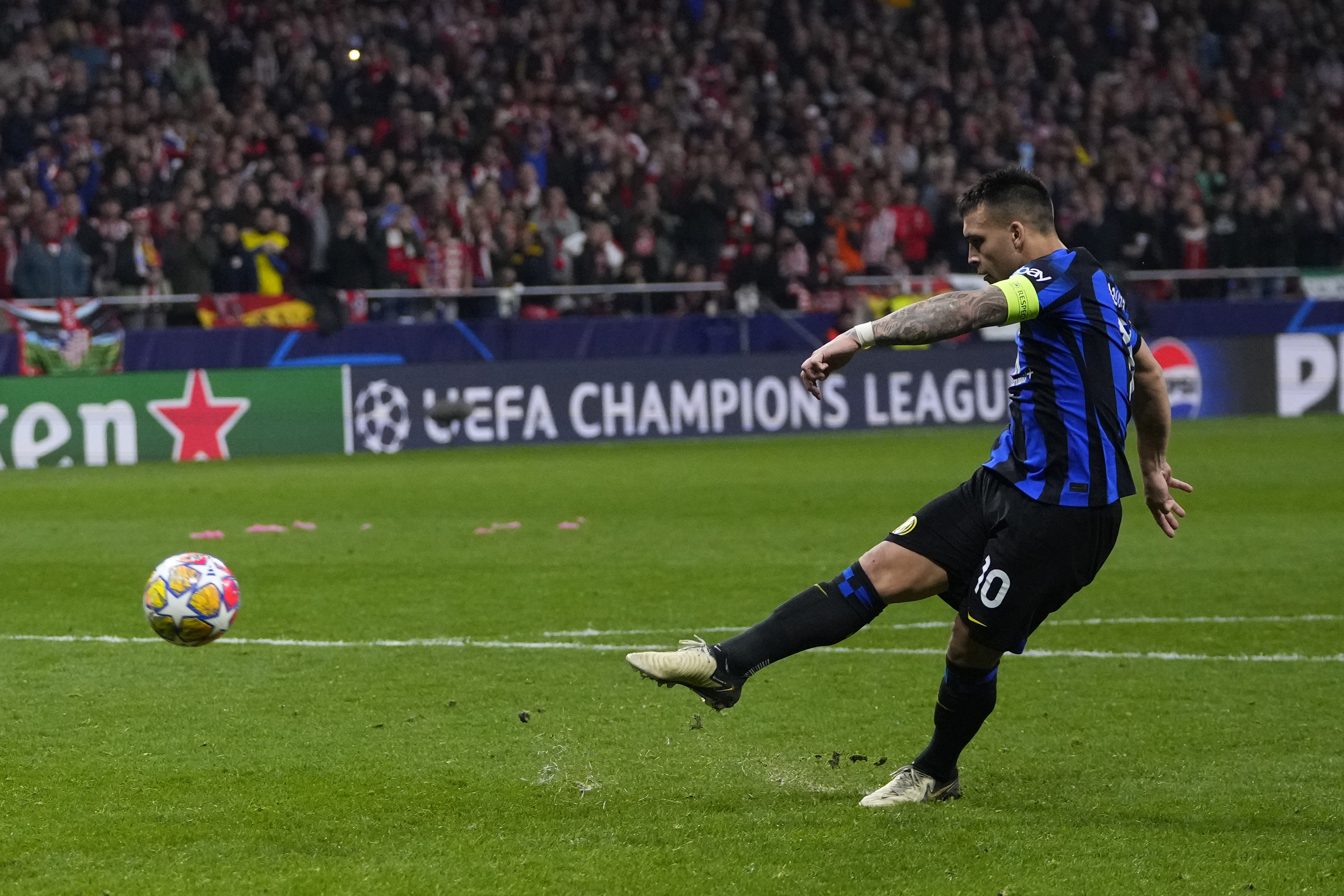 Inter Milan's Lautaro Martinez misses in the penalty shootout during the Champions League, round of 16, second leg soccer match between Atletico Madrid and Inter Milan at the Metropolitano stadium in Madrid.