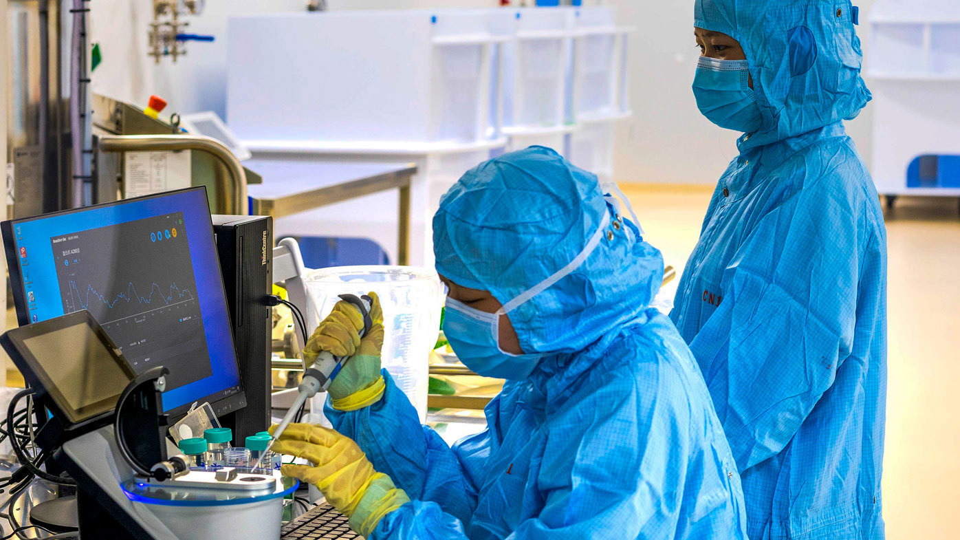 Technicians perform protein testing on the COVID-19 vaccine ReCOV at the Reco Biological Workshop in Taizhou, Jiangsu province, China