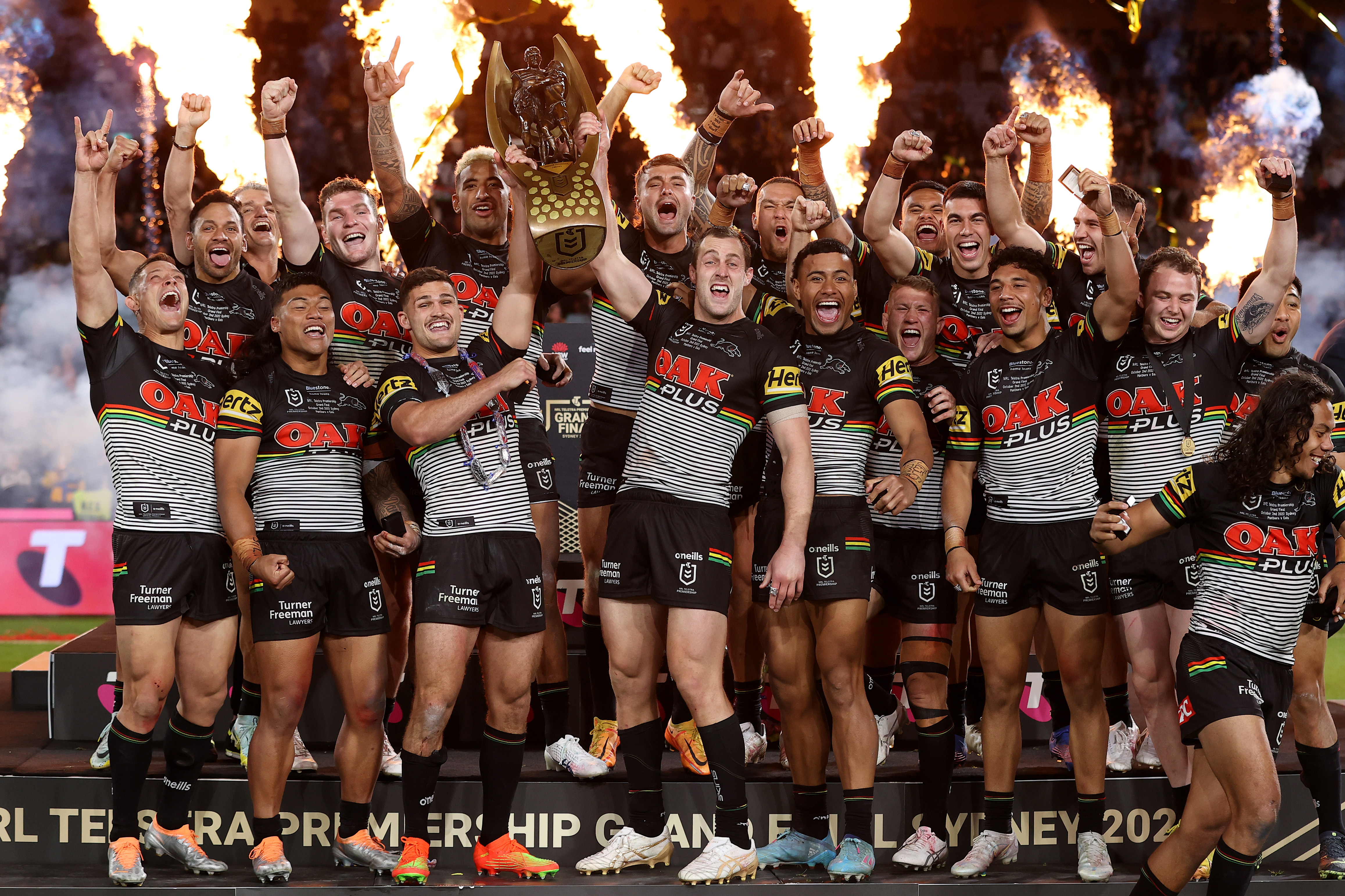 The Panthers celebrate with the NRL Premiership Trophy after victory in the 2022 NRL grand final.