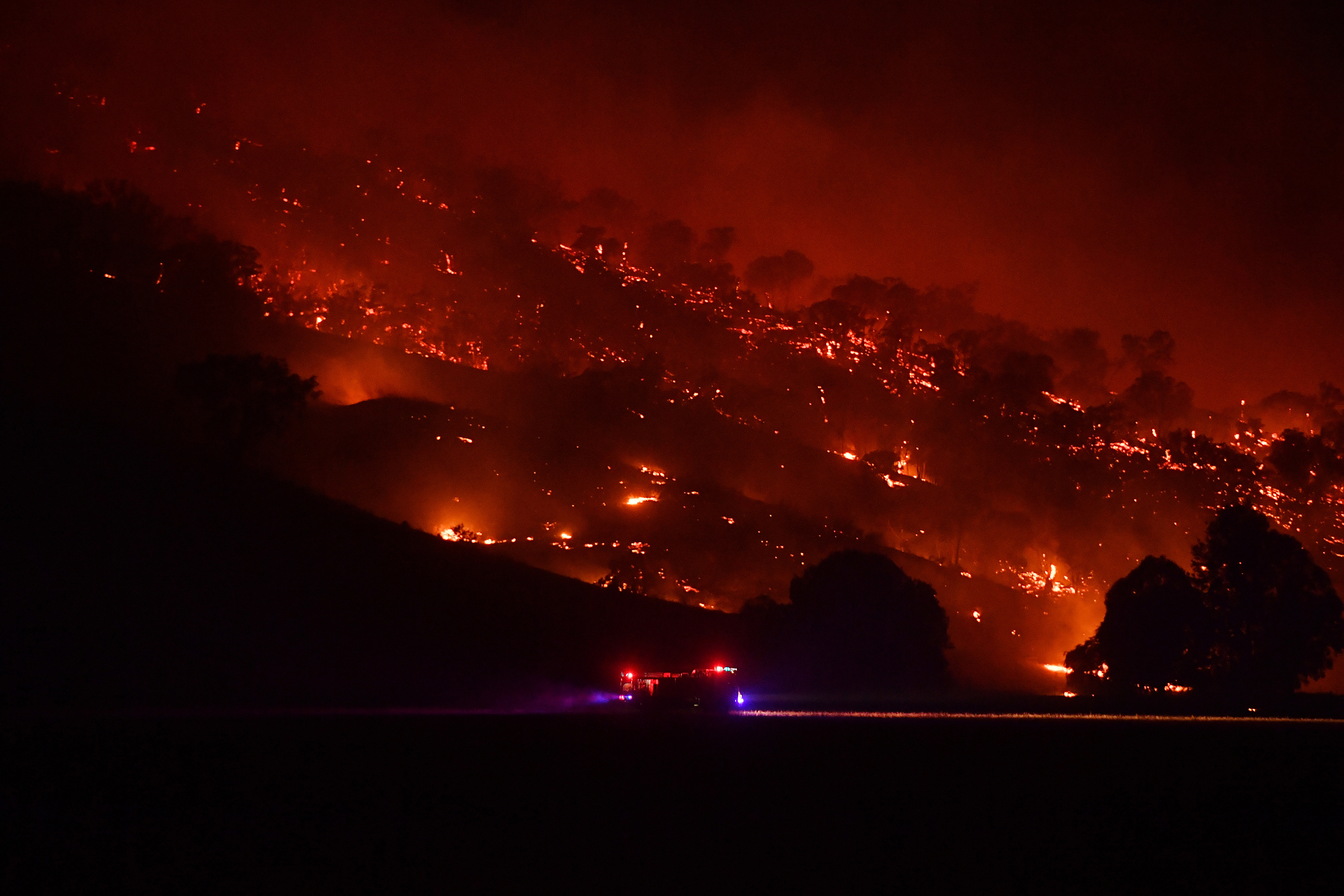 Rural Fire Service firefighters conduct property protection patrols at the Dunn Road bush fire on January 10, 2020 in Mount Adrah, Australia. 