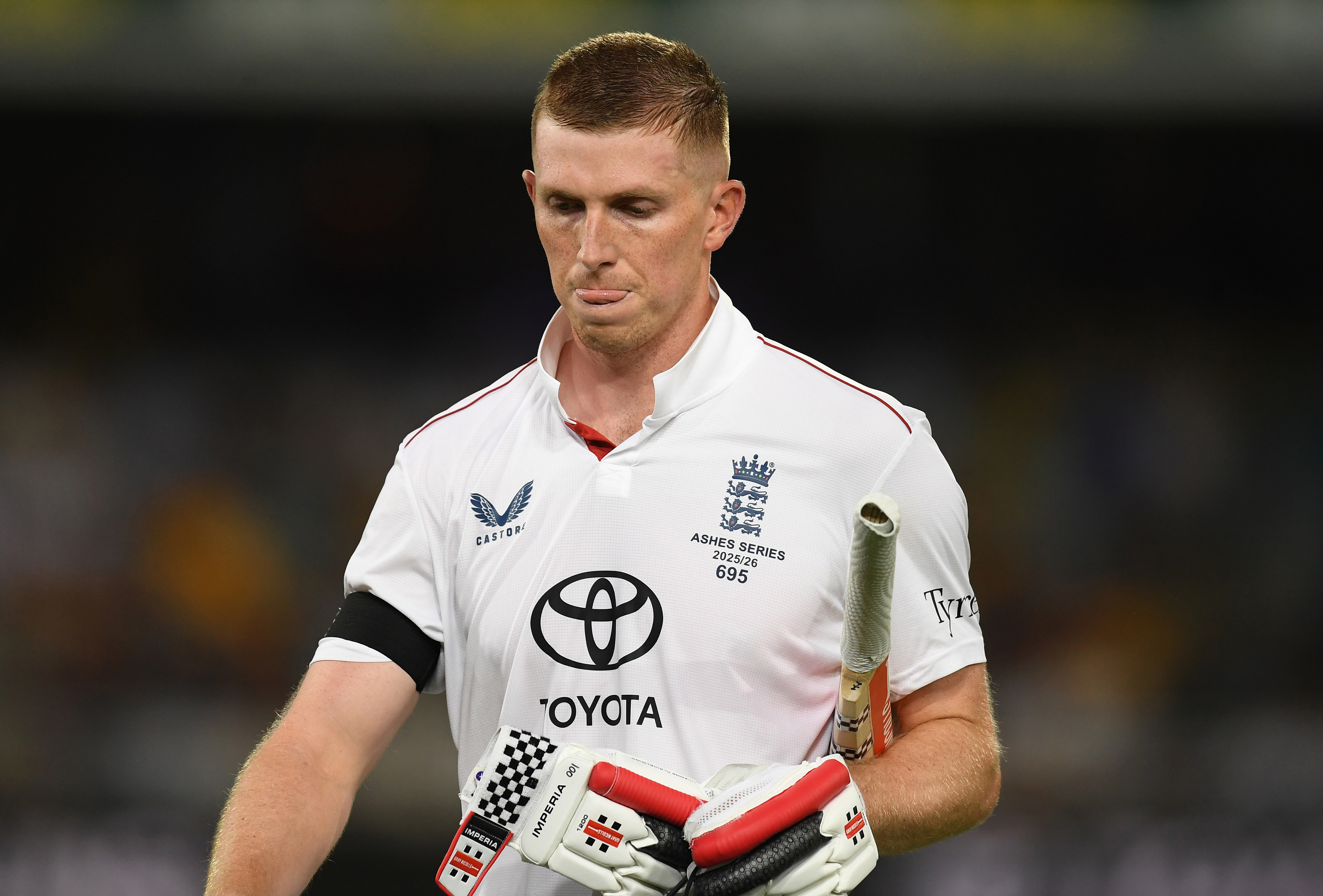 BRISBANE, AUSTRALIA - DECEMBER 06: Zak Crawle of England leaves the field after being dismissed during day three of the Second 2025/26 Ashes Series Test Match between Australia and England at The Gabba on December 06, 2025 in Brisbane, Australia. (Photo by Philip Brown/Getty Images)