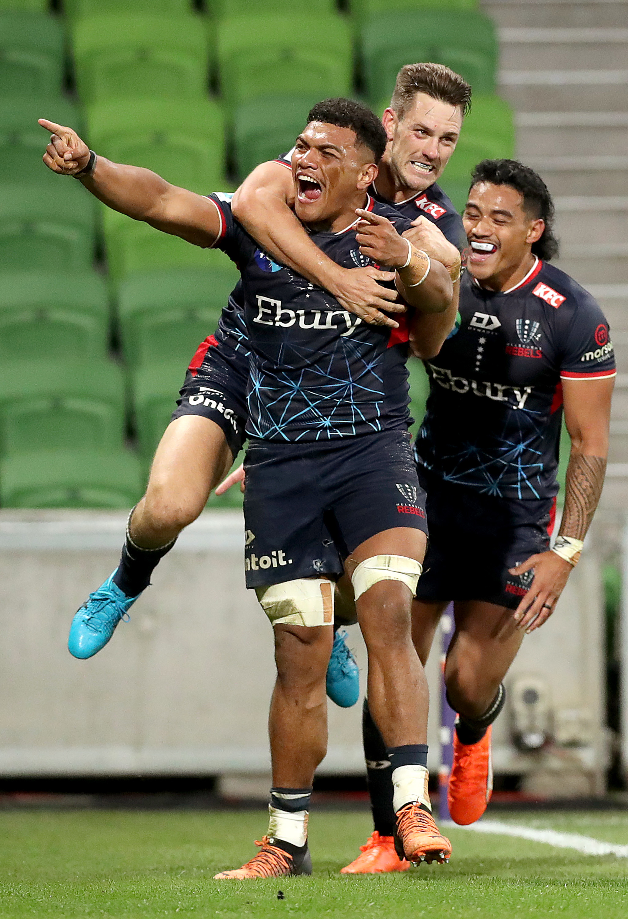 Vaiolini Ekuasi of the Rebels celebrates scoring a try.