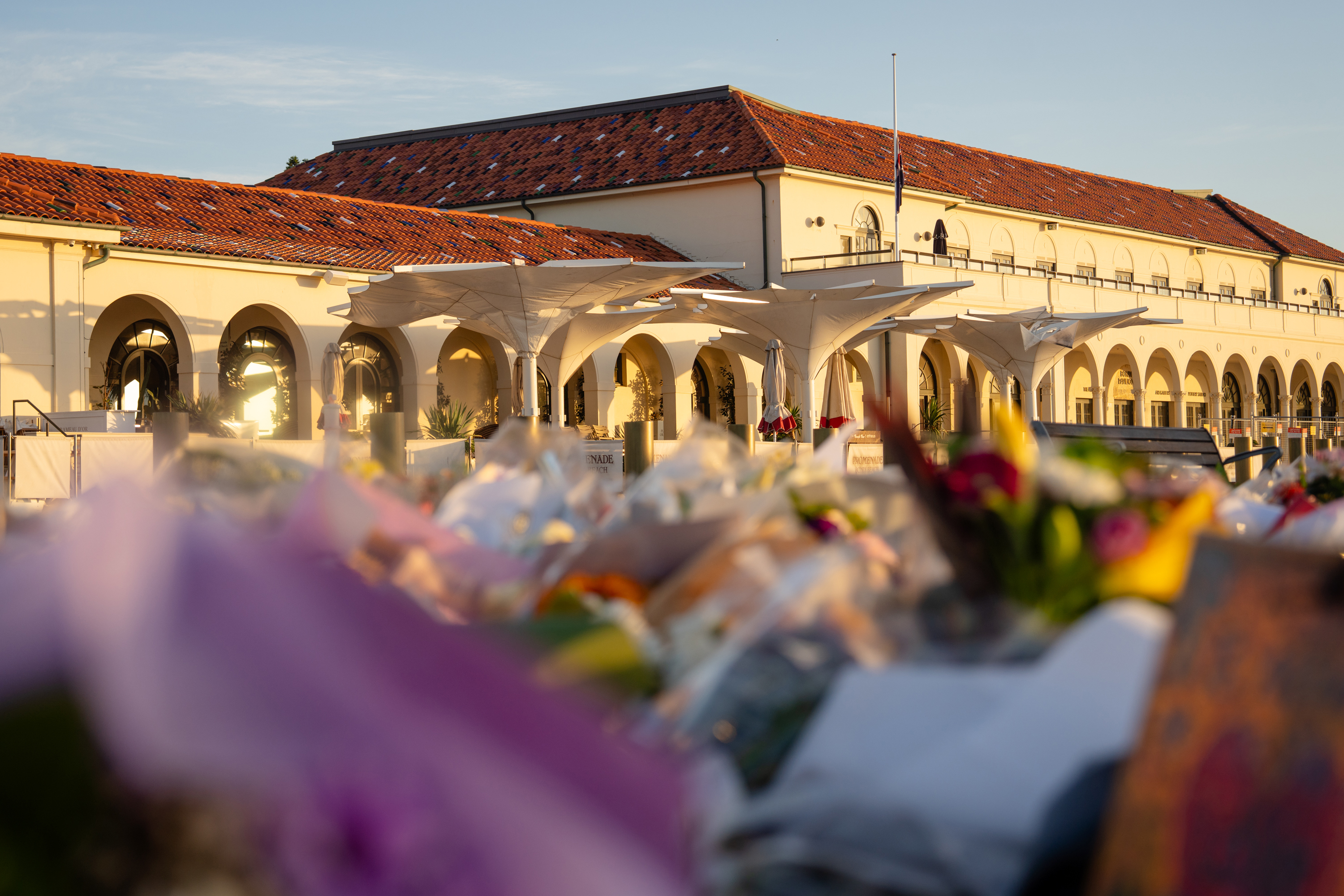 Flowers rest in front of the Bondi Pavilion at a memorial site, on December 18, 2025 in Sydney, Australia.
