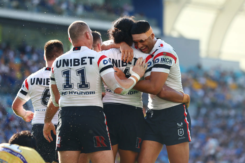 Sitili Tupouniua of the Roosters celebrates a try.