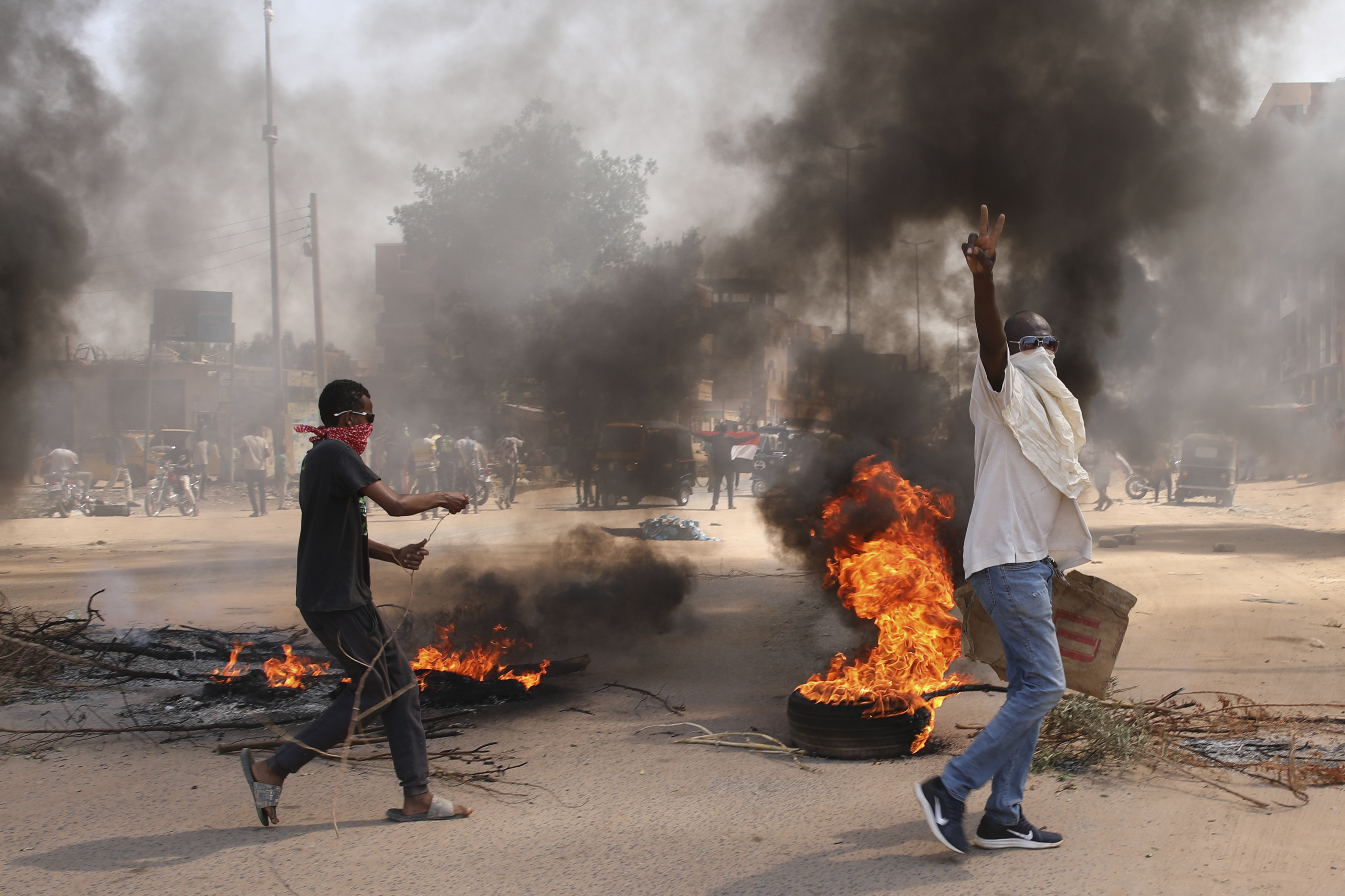 Sudanese demonstrators demand the government's transition to civilian rule in Khartoum, Sudan, Thursday, October 21, 2021.