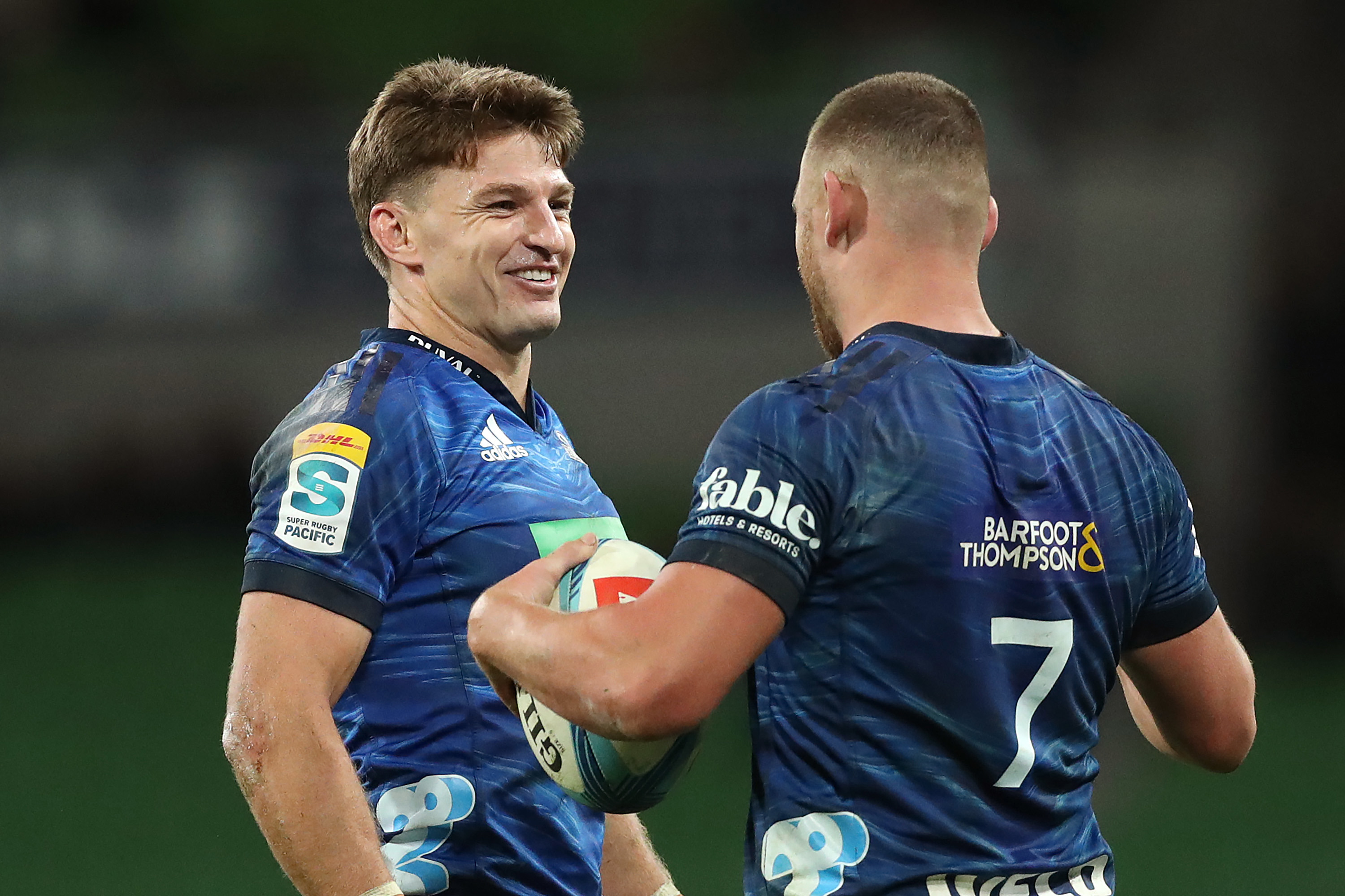 Beauden Barrett celebrates with Dalton Papali'i during the round seven Super Rugby Pacific match between Melbourne Rebels and Blues.