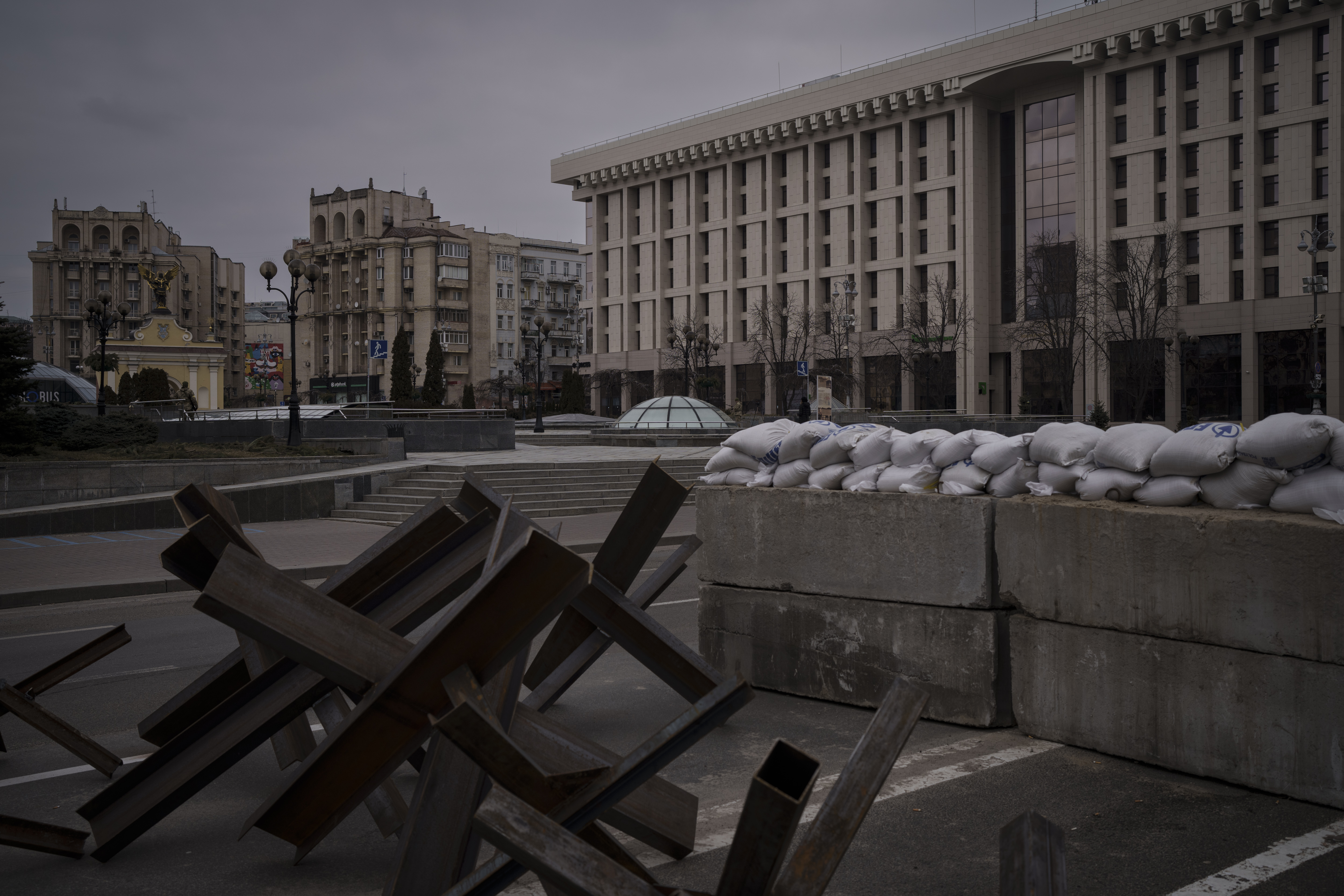 Barricades partially block the main road in front of the Maidan Square, nearly empty during an air raid alarm in Kyiv, Ukraine, Wednesday, March 9, 2022 