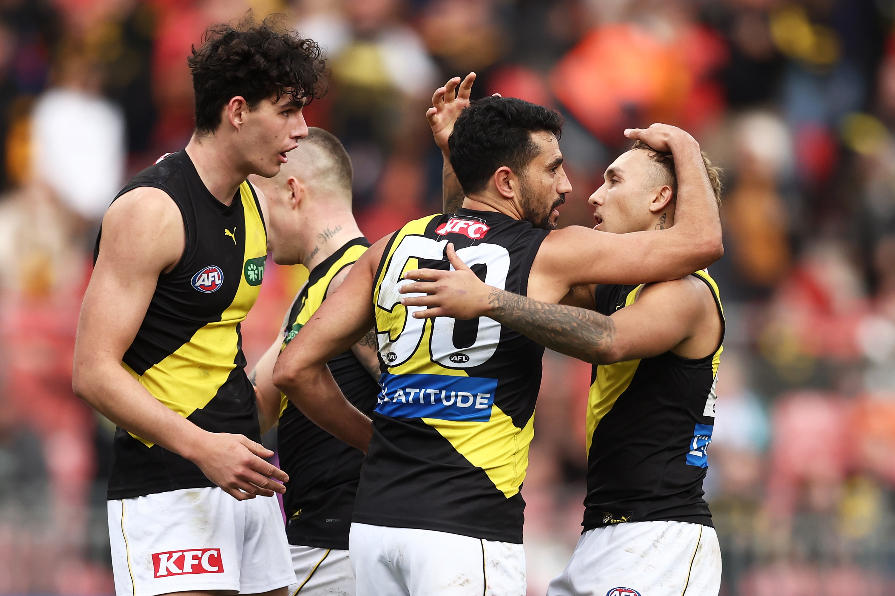 SYDNEY, AUSTRALIA - JUNE 04: Marlion Pickett of the Tigers celebrates with team mates after kicking the fianl goal during the round 12 AFL match between Greater Western Sydney Giants and Richmond Tigers at GIANTS Stadium, on June 04, 2023, in Sydney, Australia. (Photo by Matt King/AFL Photos/via Getty Images )