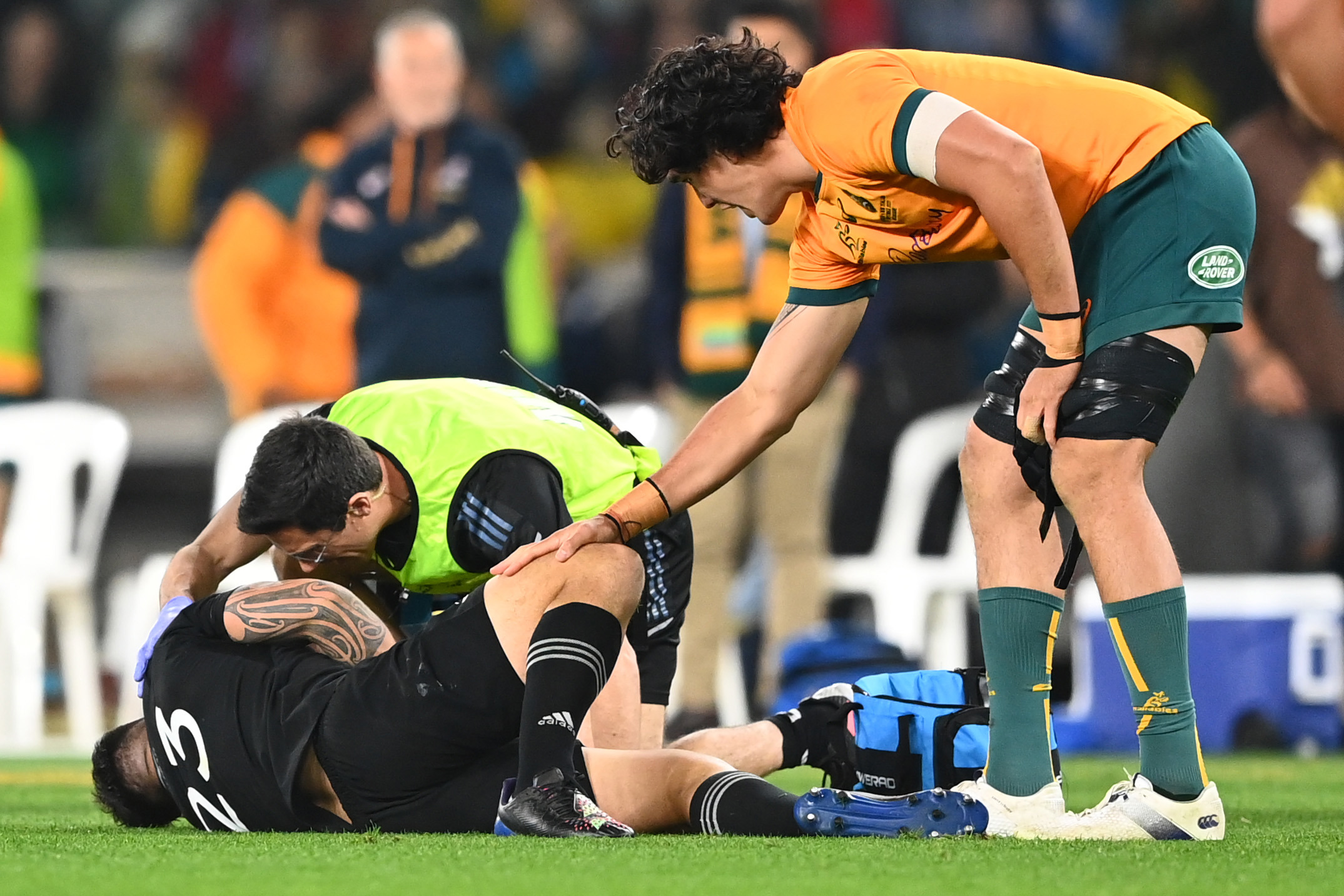 Darcy Swain consoles Quinn Tupaea after a season-ending tackle.