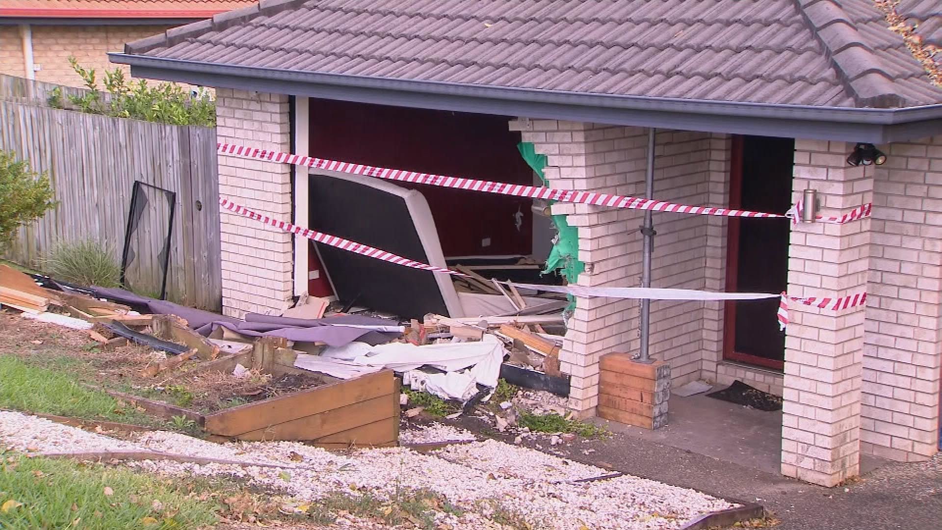 Video has shown the moment a car ploughs into a family's bedroom north of Brisbane.Police alleged the 29-year-old driver had been hooning just moments before the crash, leaving the home in ruins and a family heartbroken.