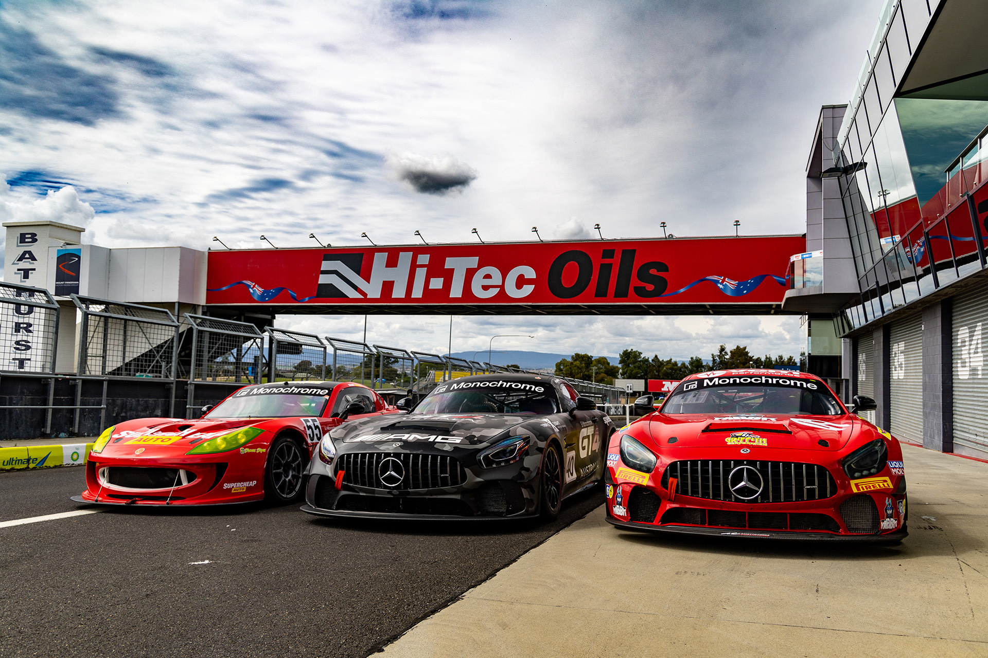 A Ginetta G55 GT4 (left) with two Mercedes-AMG racers.