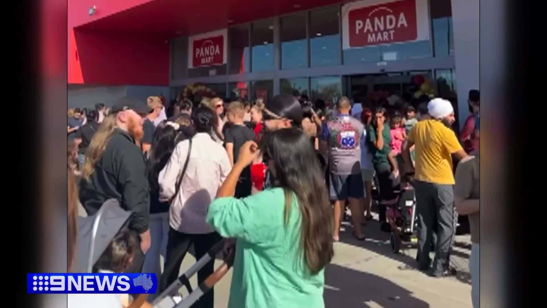 Police were forced to step in when angry customers swamped the Panda Mart warehouse after waiting in line for hours.