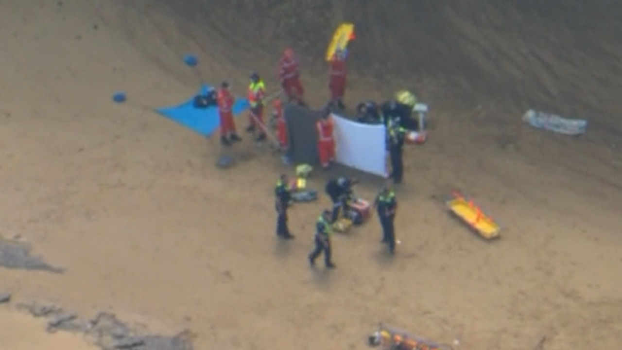 Three people injured after cliff face collapses at Bells Beach.