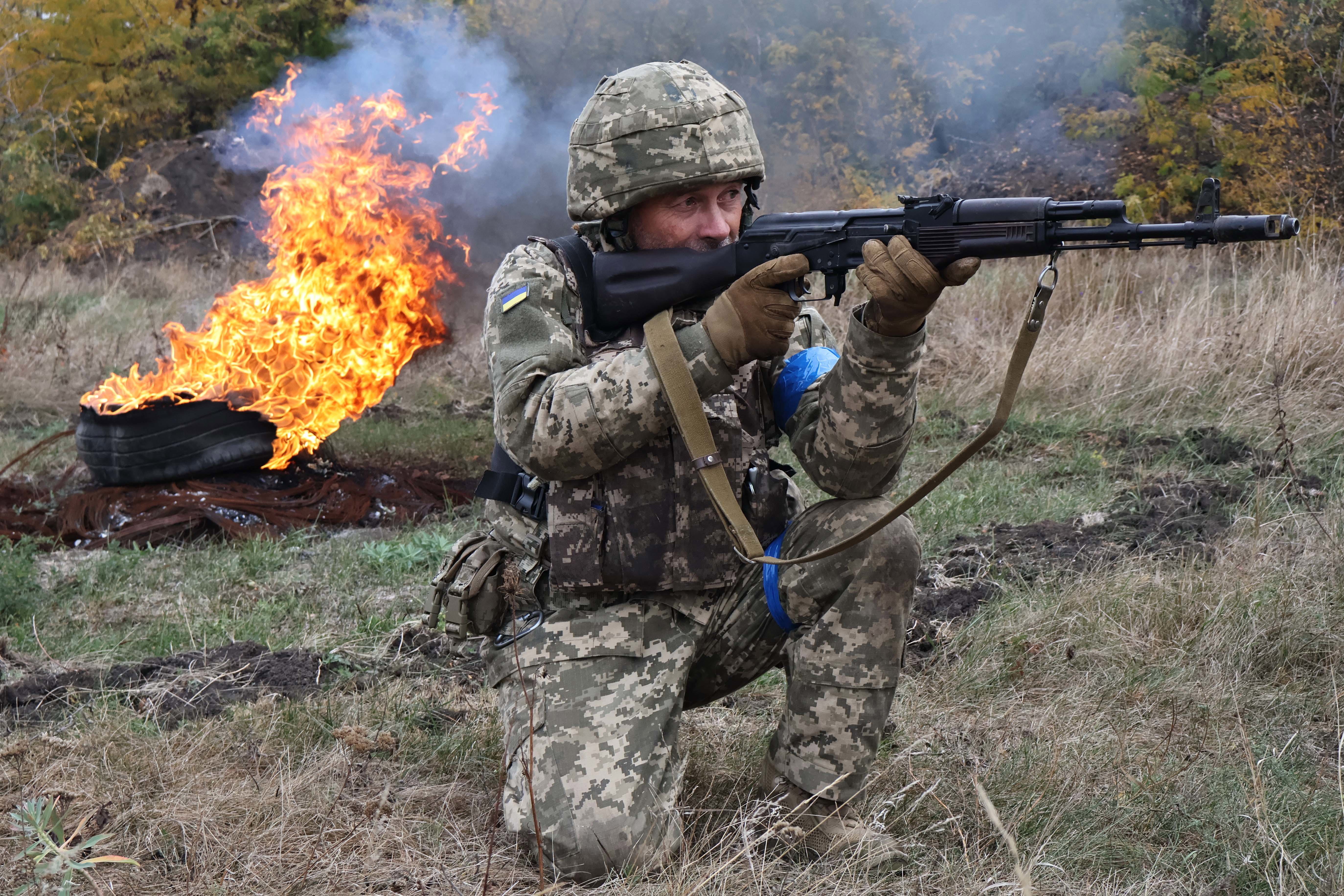 In this photo provided by Ukraine's 65th Mechanized Brigade press service, recruits attend drills at a training ground in the Zaporizhzhia region, Ukraine.