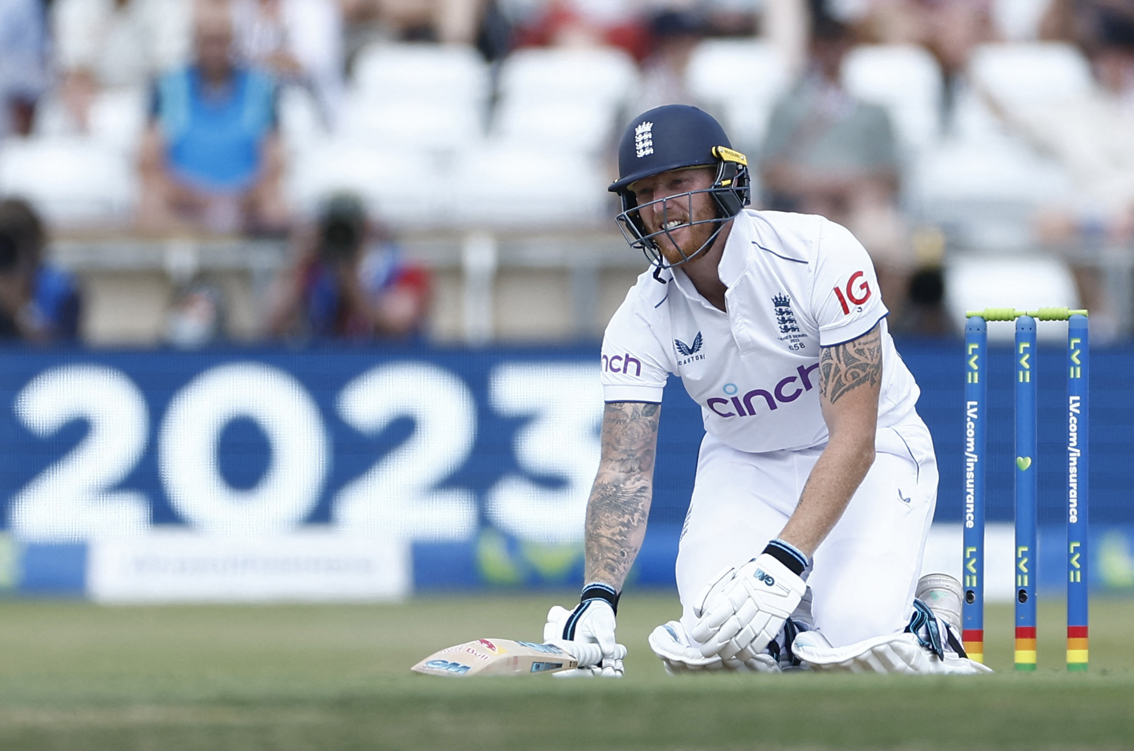 England's Ben Stokes reacts after being hit by a ball bowled by Australia's Mitchell Starc.