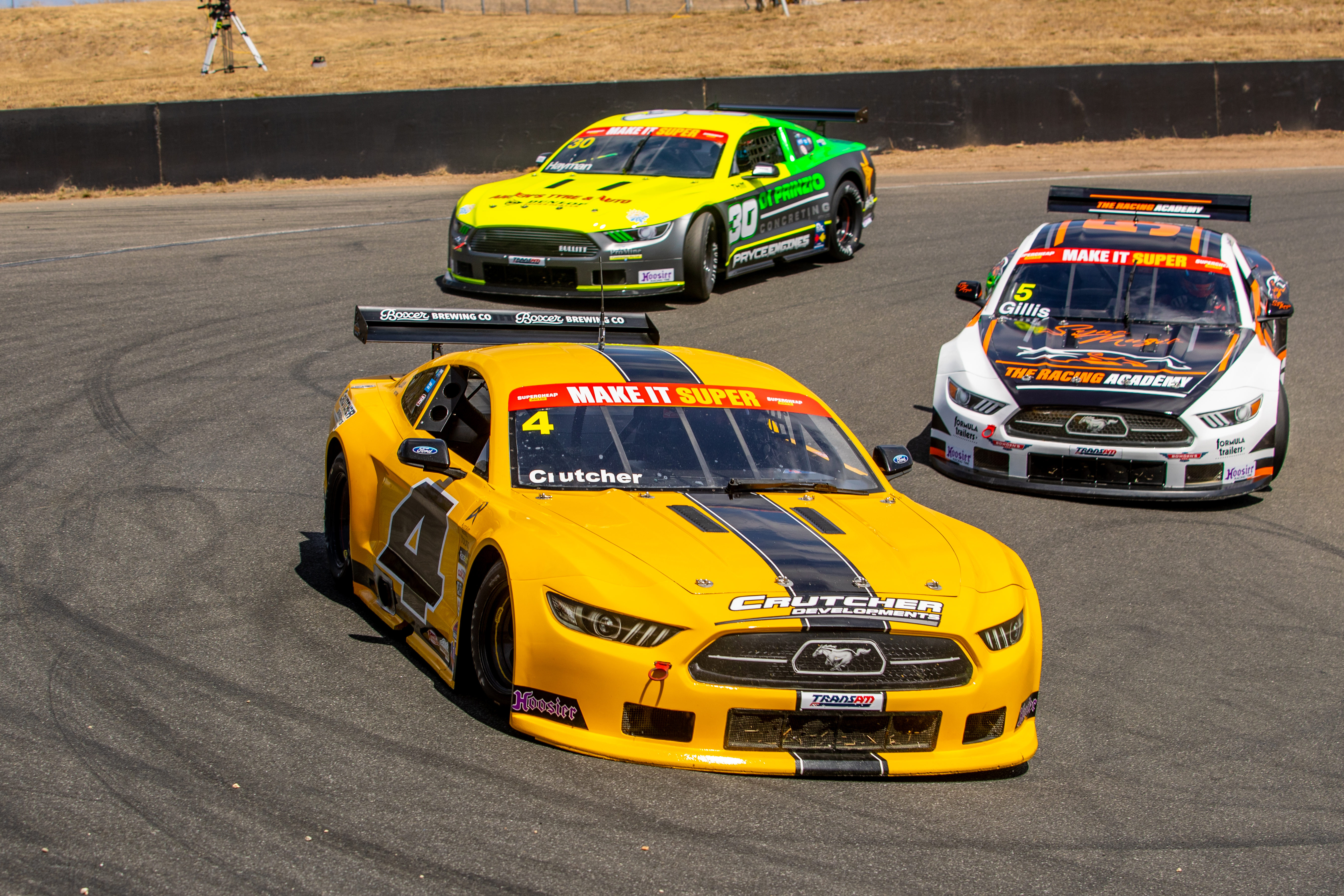 A gaggle of TA2-spec Ford Mustangs at Symmons Plains.