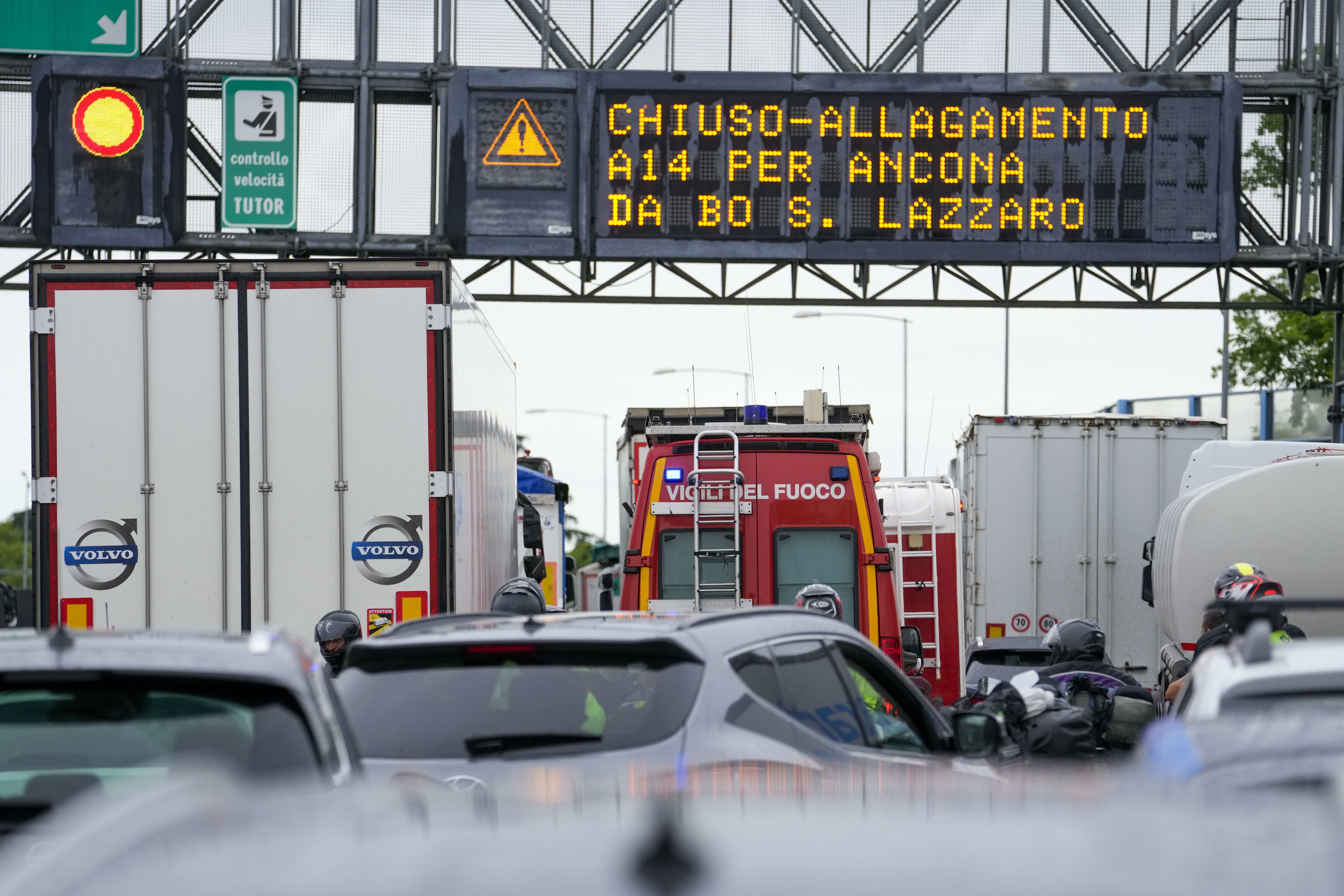 Cars queue on the A14 highway near Bologna, in the northern Italian region of Emilia Romagna, Wednesday, May 17, 2023.