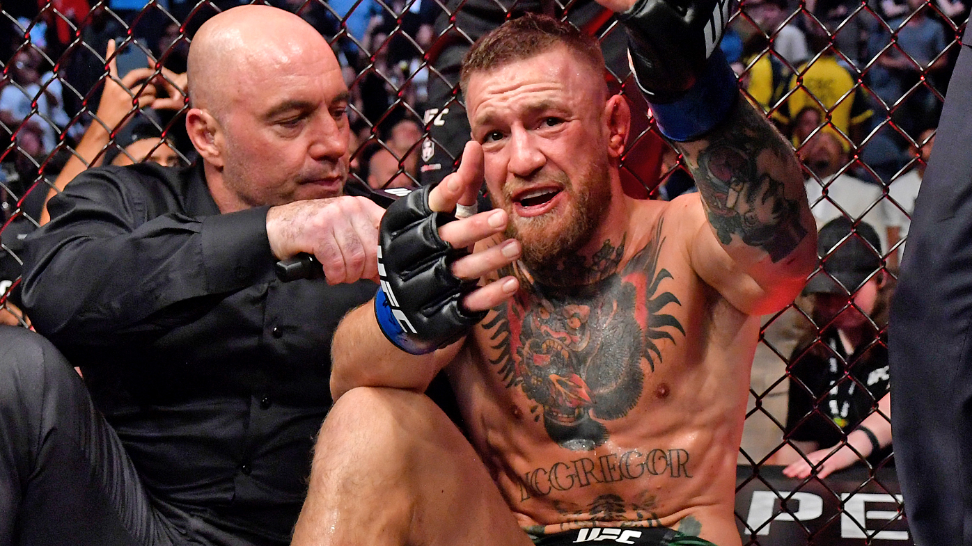 Conor McGregor of Ireland is interviewed by Joe Rogan after his loss to Dustin Poirier