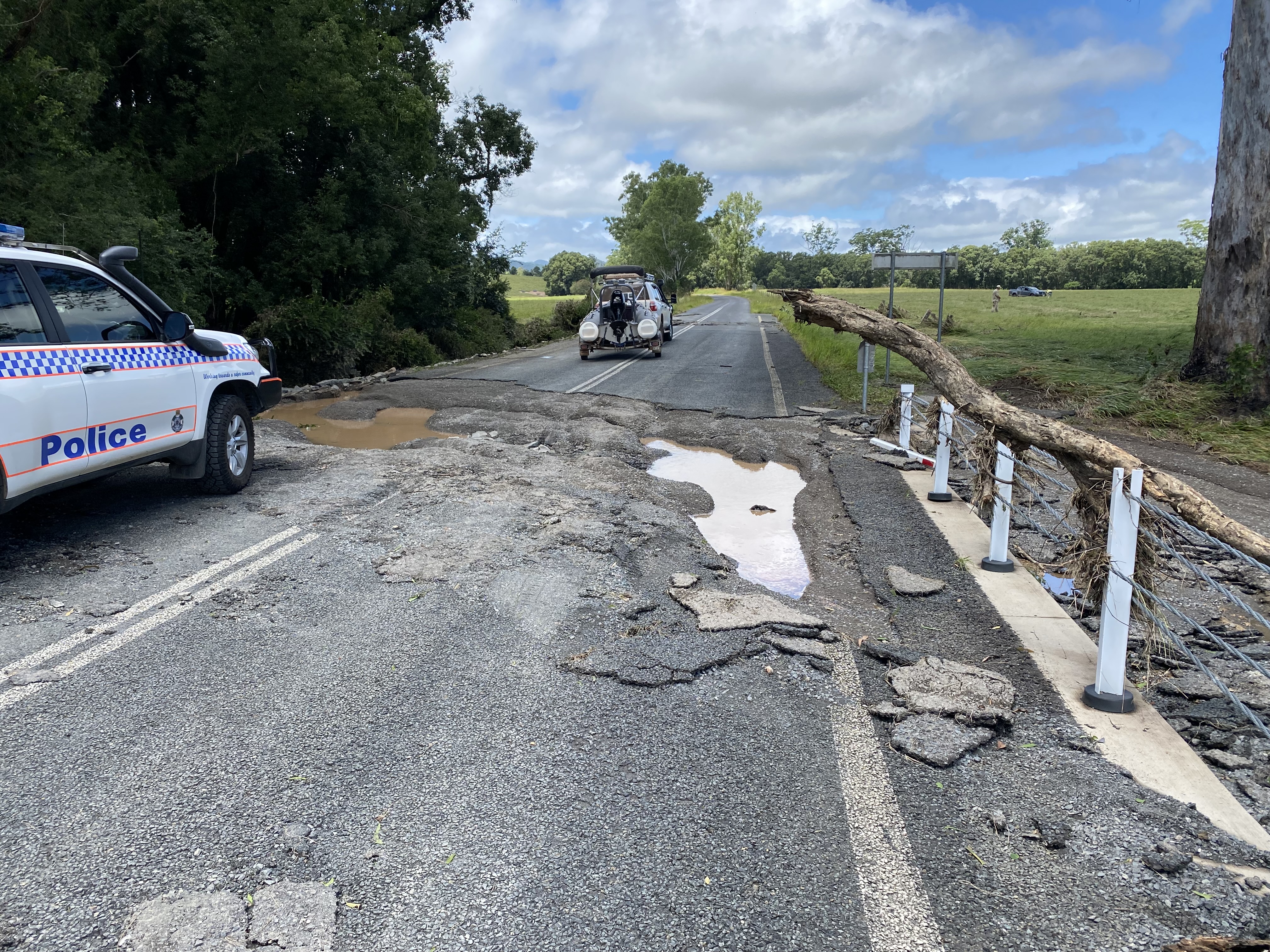 A cracked road is seen in Gympie, in south-east Queensland. Cedar Pocket Road has been subject to extreme rain and flash flooding.