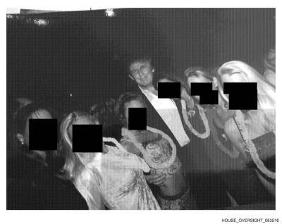 This undated, redacted photo released by Democrats on the House Oversight Committee shows Donald Trump standing with a group of women.