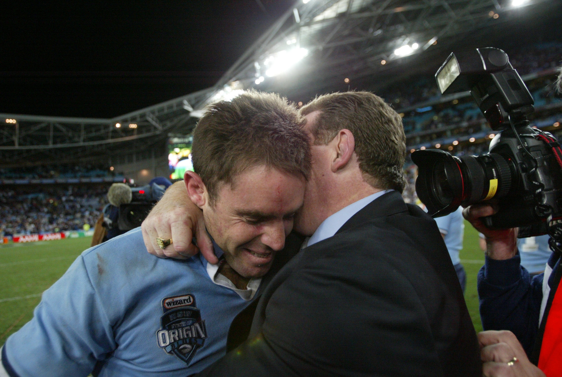 NSW coach Phil Gould hugs Brad Fittler after the NSW claimed victory in Origin III at Telstra Stadium, Wednesday 7 July 2004. Photo: Craig Golding