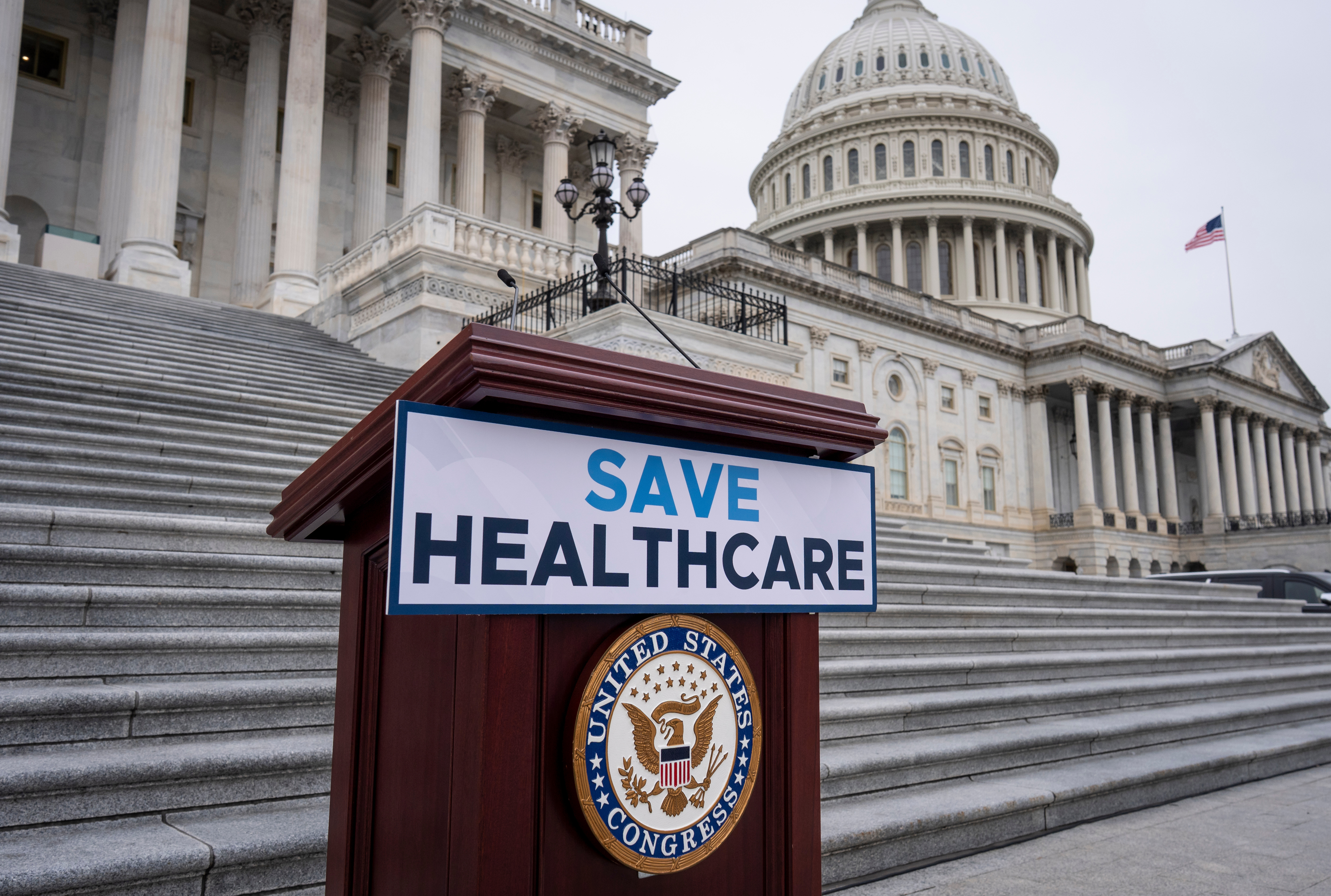 House Democrats prepare to speak on the steps of the Capitol to insist that Republicans include an extension of expiring health care benefits as part of a government funding compromise, in Washington, Tuesday, Sept. 30, 2025. (AP Photo/J. Scott Applewhite)