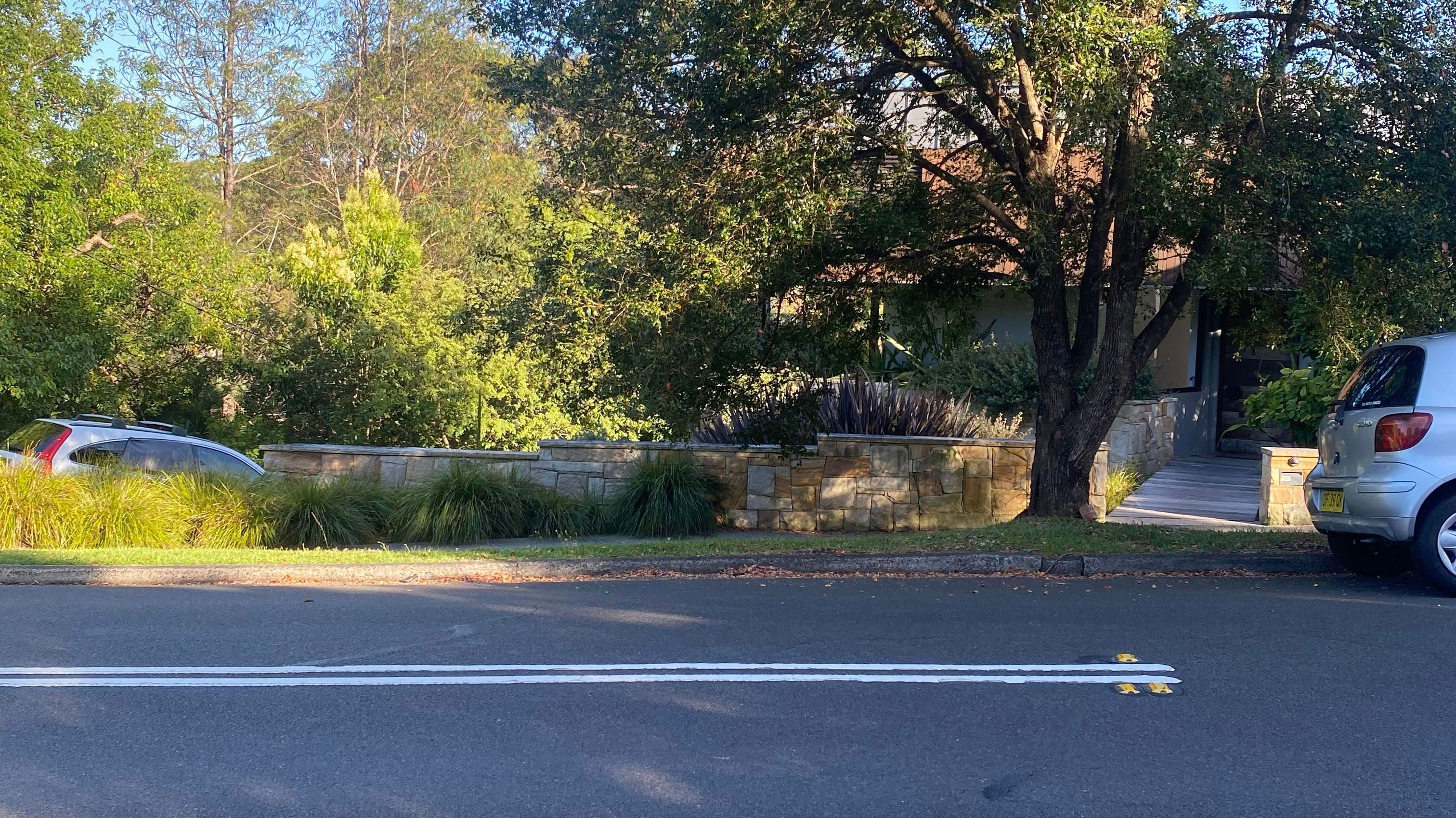 The car is now shown parked legally ahead of the road's double nine. There are no signs to indicate parking is not allowed.