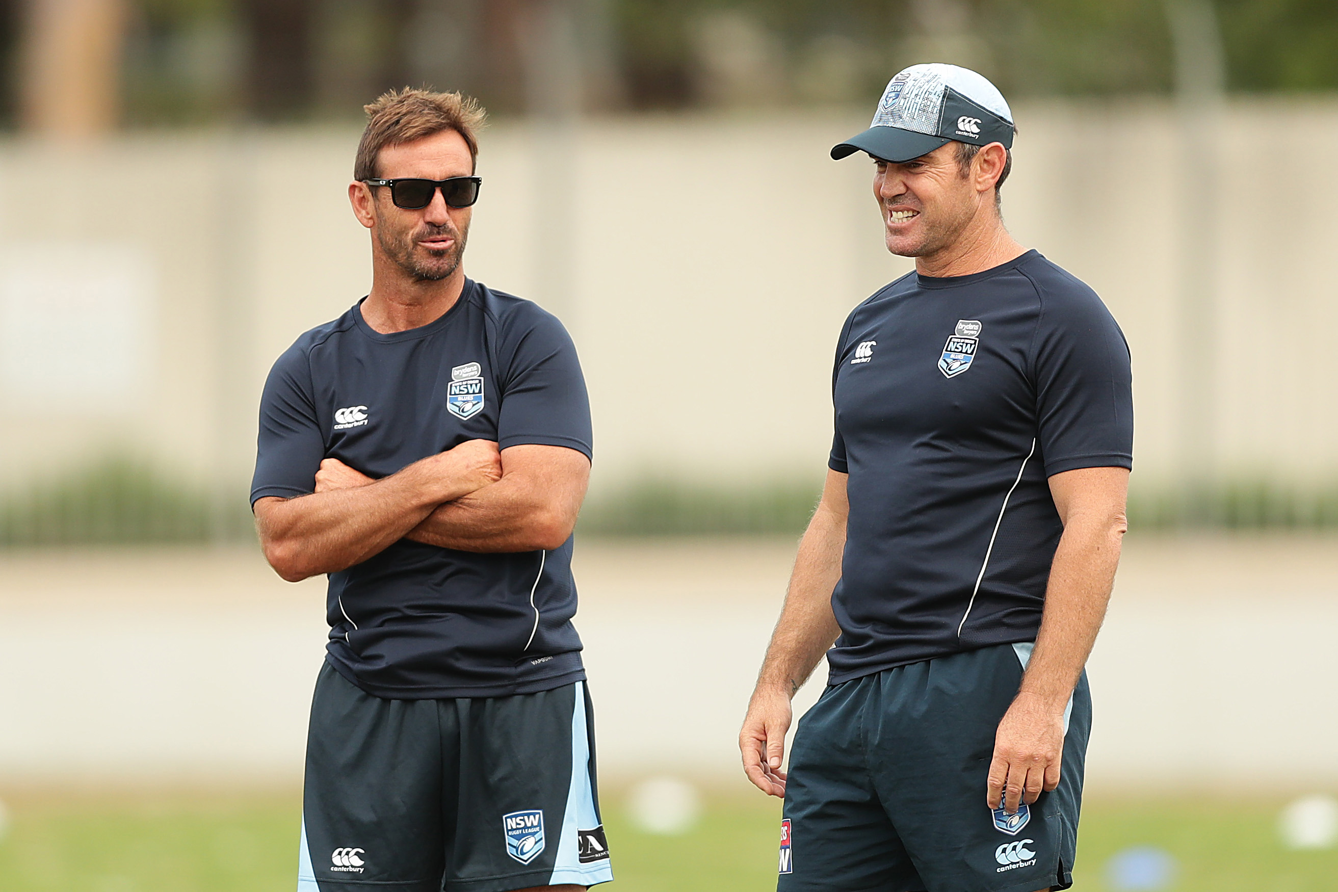 Former NSW Blues head coach Brad Fittler (right) speaks to Andrew Johns.