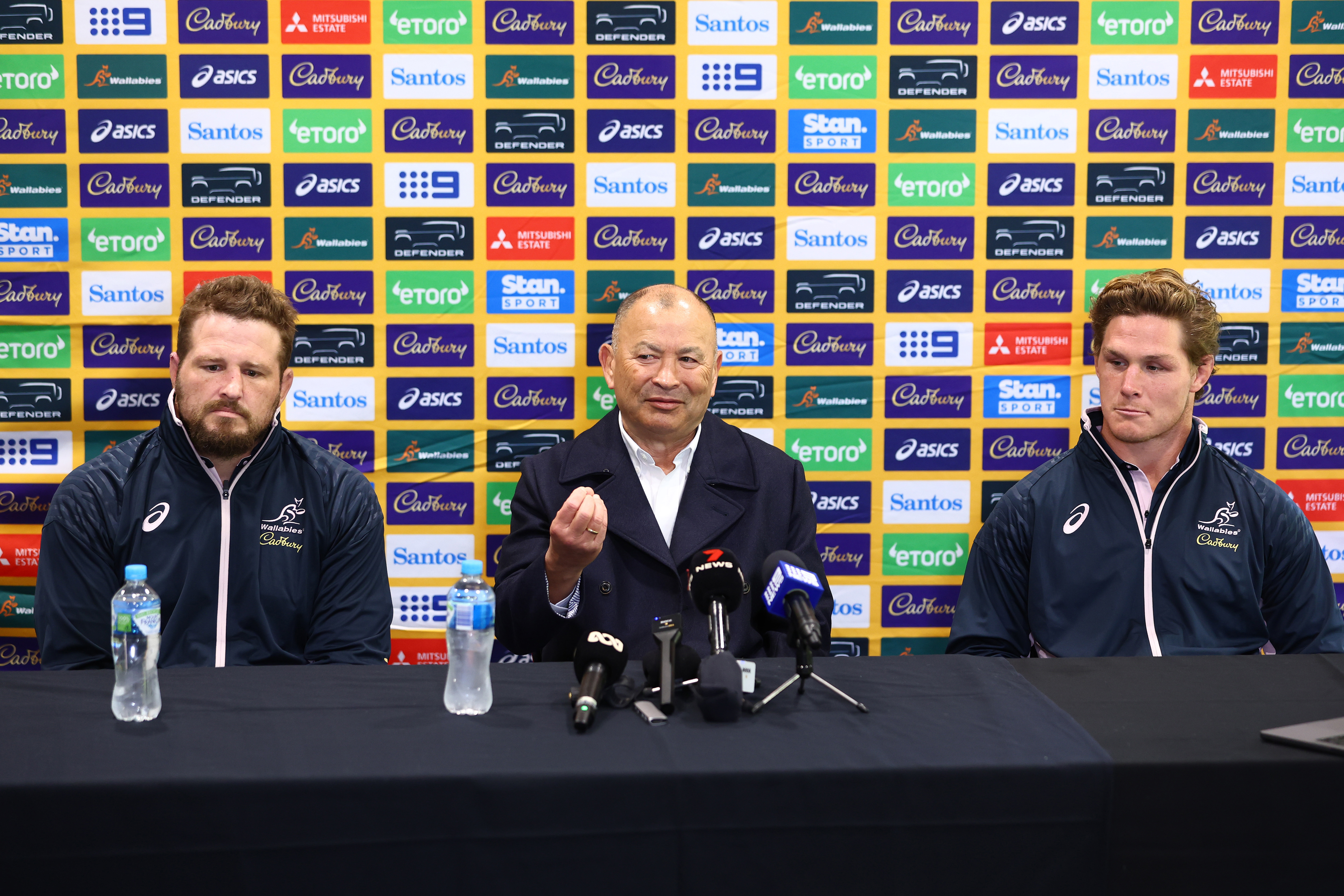 Eddie Jones speaks with media with co-captains James Slipper and Michael Hooper.