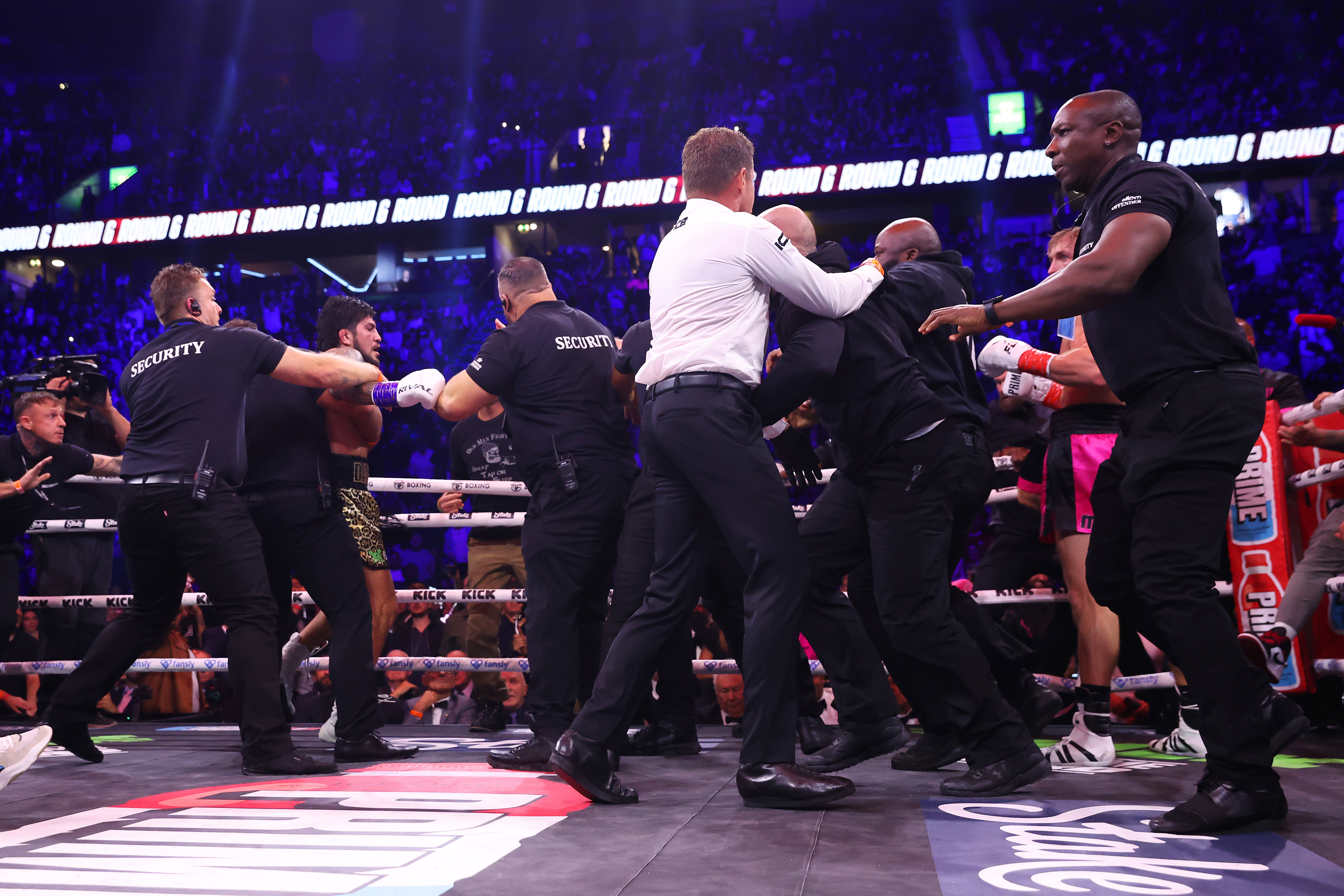 Security guards storm the ring as the farcical fight between Logan Paul and Dillon Danis descends into chaos.