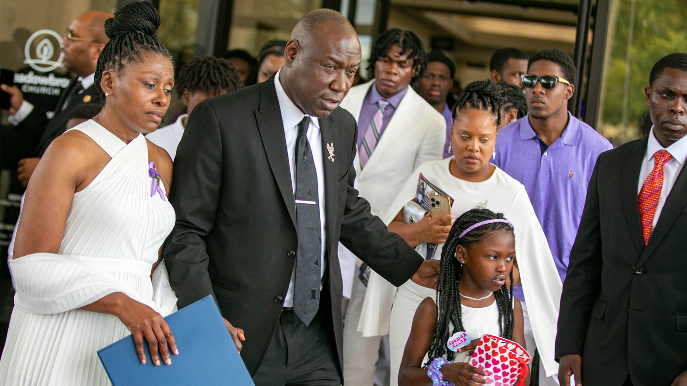 Pamela Dias, the mother of Ajike Owens, lawyer Ben Crump and Africa Owens leave after the funeral for Ajike Owens