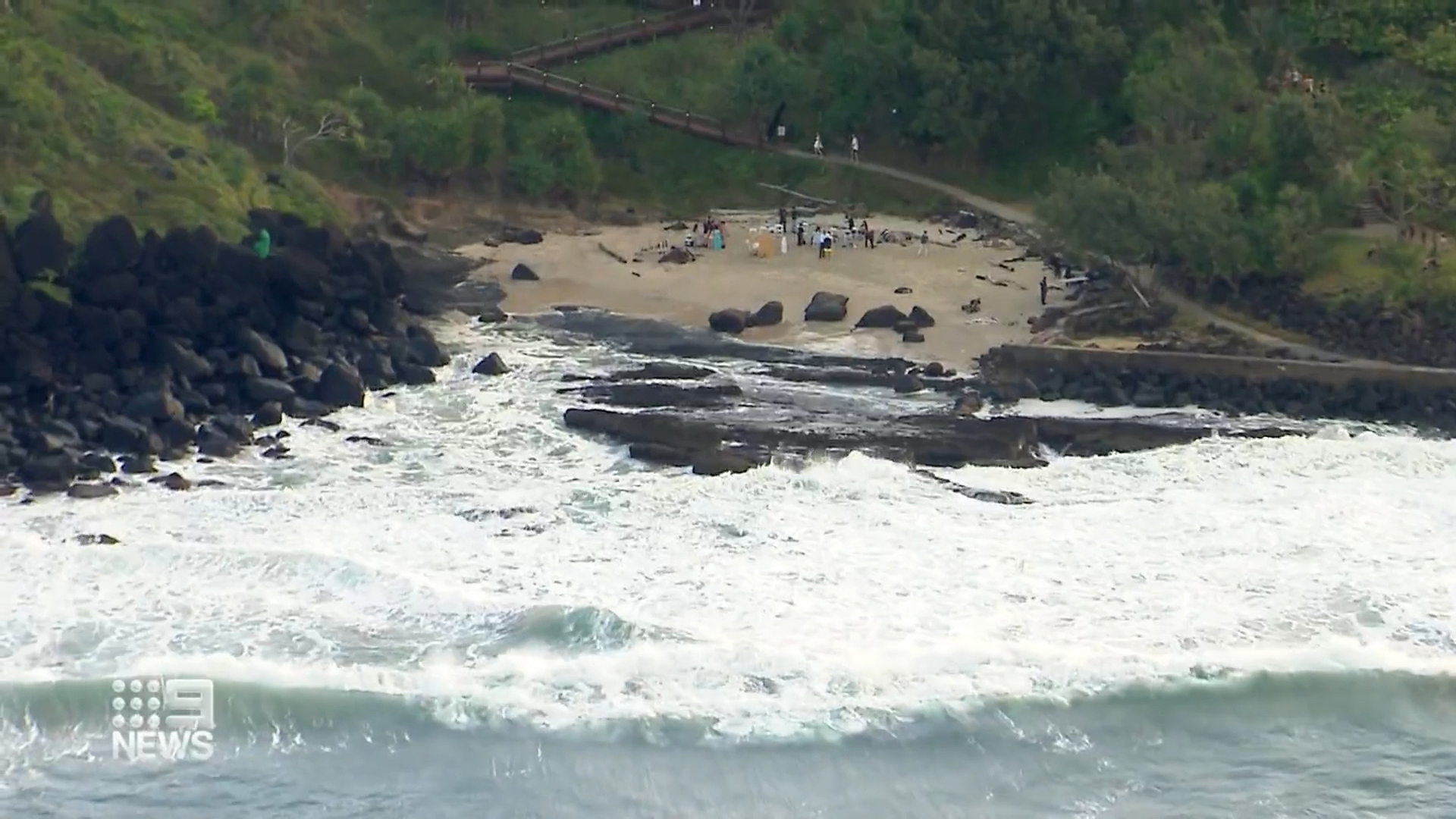 Guests at a gender reveal party for an expectant couple at a Queensland beach risked their lives to try and save a woman who drowned after trying to help her daughter.The 51-year-old mother and teenage daughter got into trouble in the treacherous Froggies Beach swell on the Gold Coast.
Shoieb Fadeh, 31, who was at the party, rushed into the water to help alongside lifesavers after seeing the rescue unfold - but then had to be saved himself.