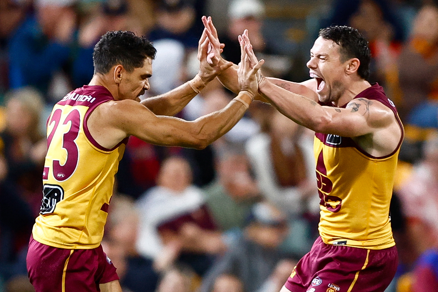 Charlie Cameron of the Lions celebrates a goal 