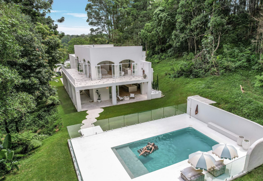 This is no shrinking violet, a med style house nestled in amongst the rainforest. 