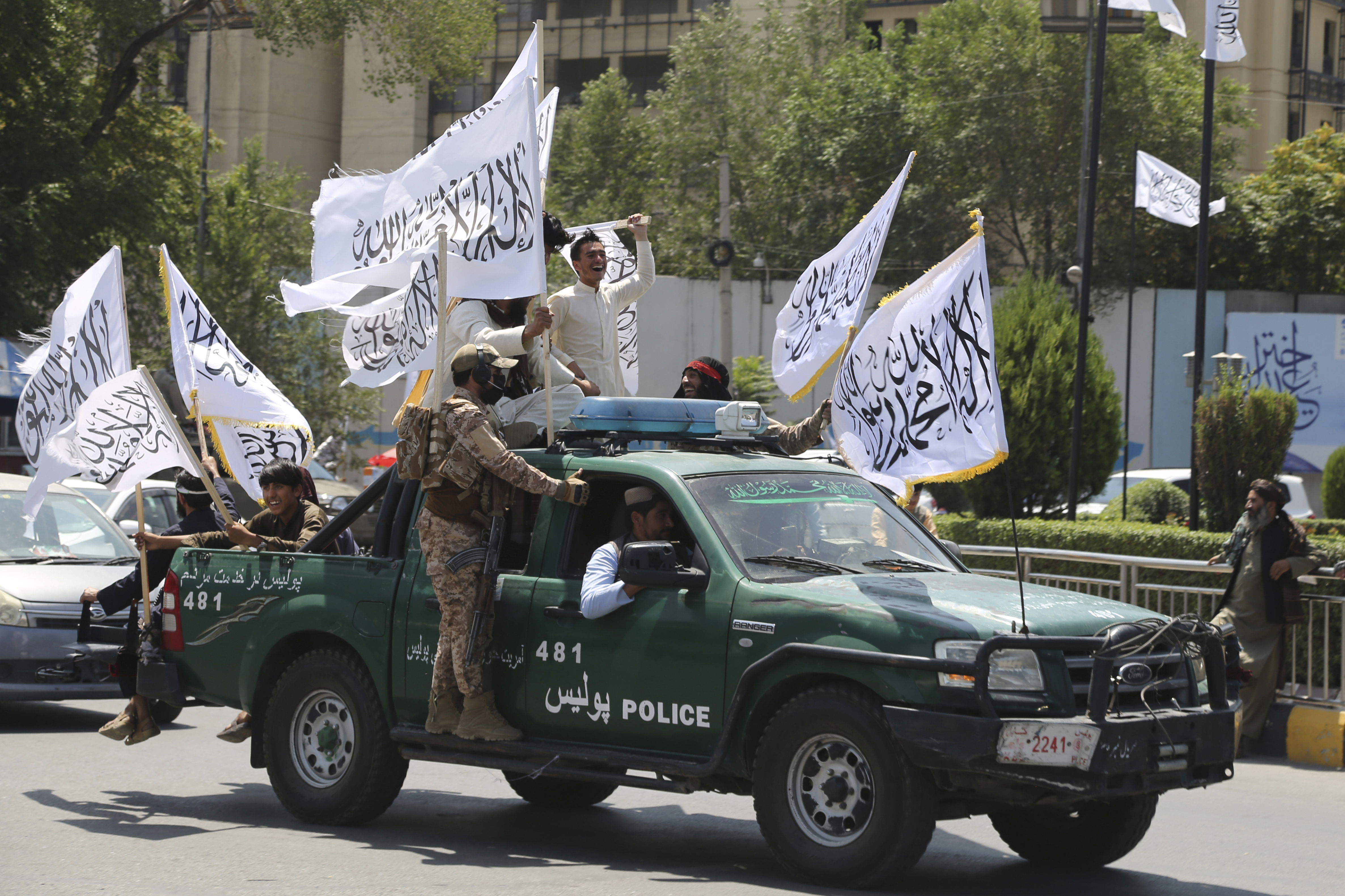 Taliban fighters celebrate the third anniversary of the withdrawal of US-led troops from Afghanistan, in Kabul, Afghanistan, Wednesday, August 14, 2024.