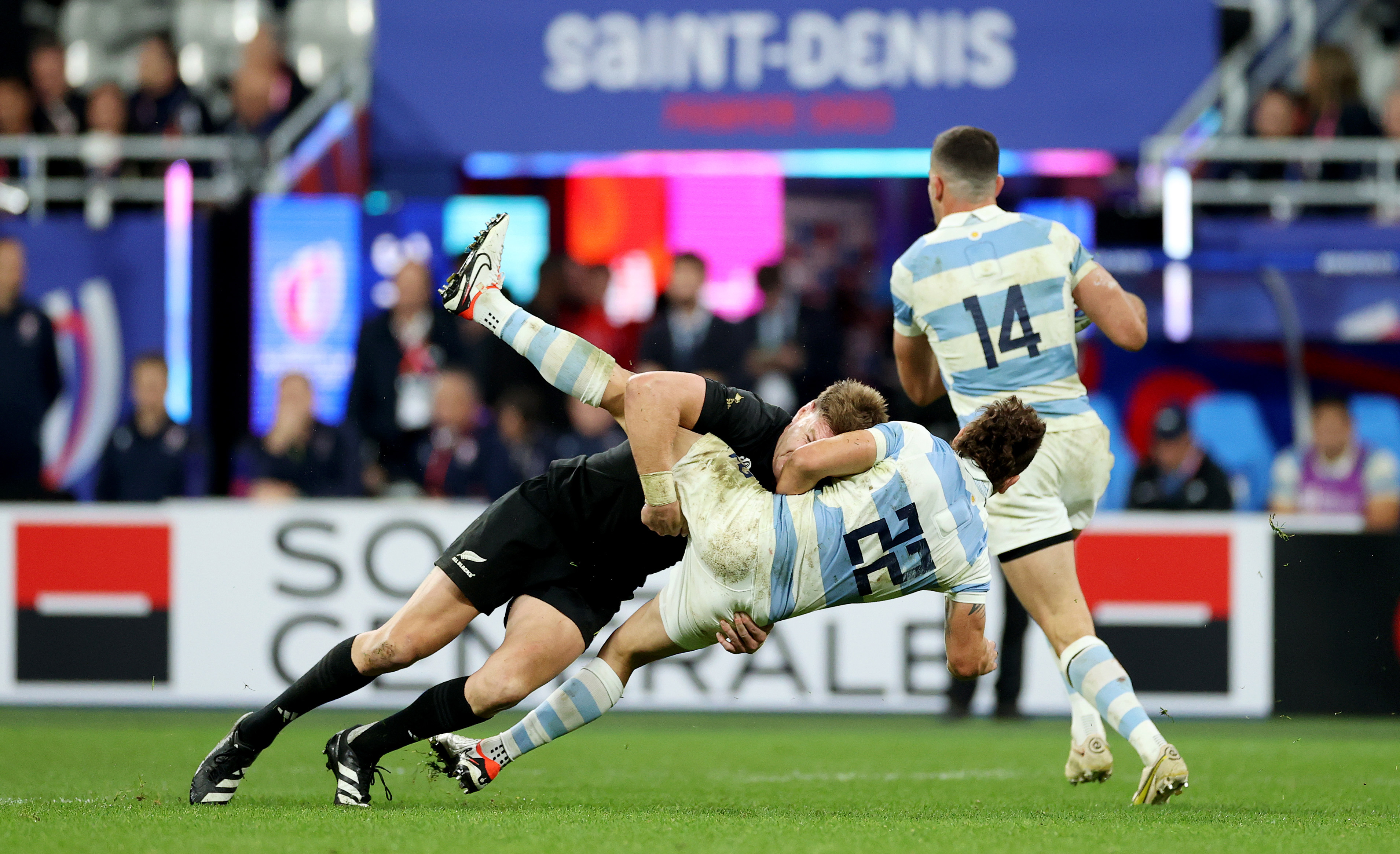 Nicolas Sanchez of Argentina is tackled by Jordie Barrett of New Zealand.