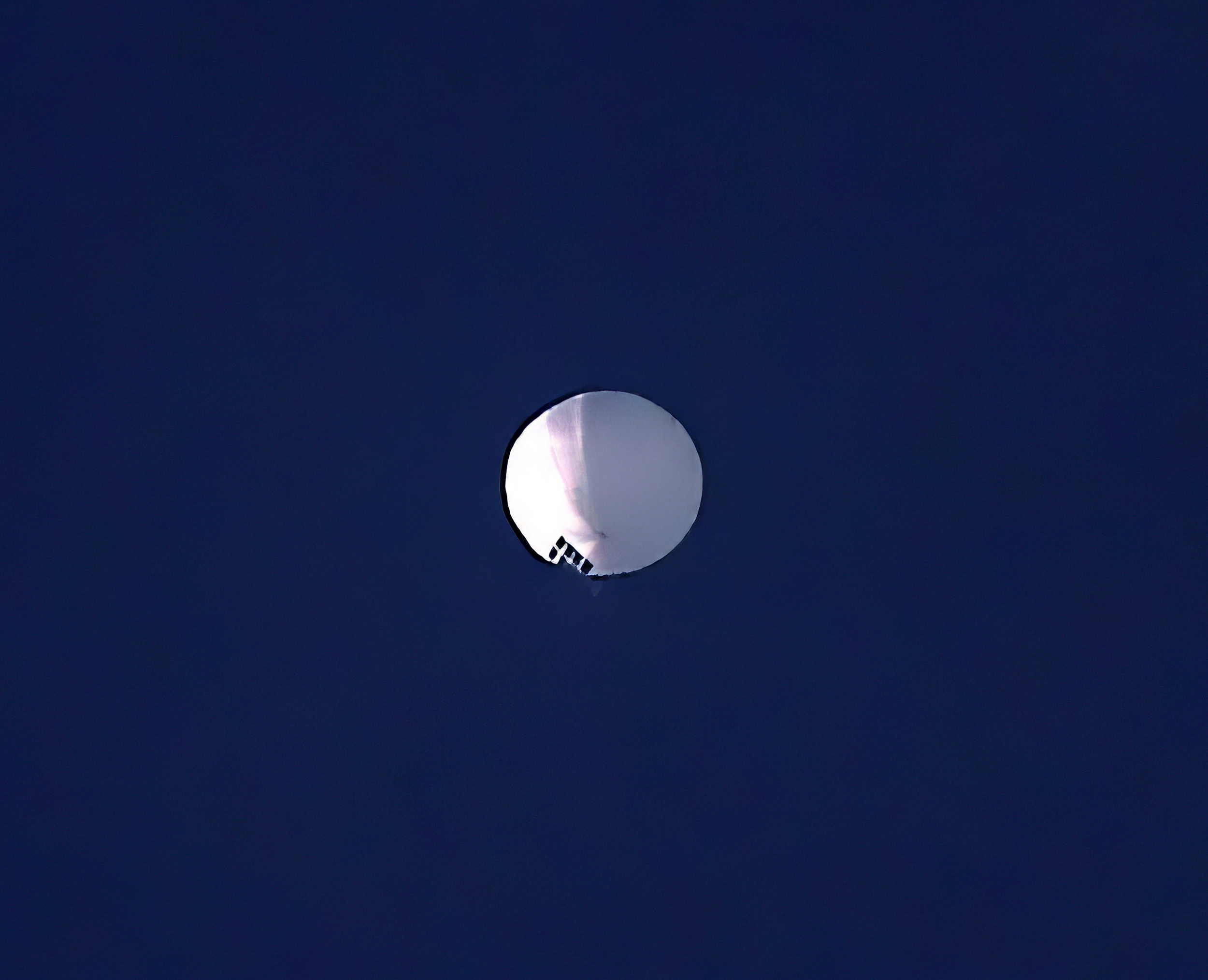 A high altitude balloon floats over Billings, Mont., on Wednesday, Feb. 1, 2023. 