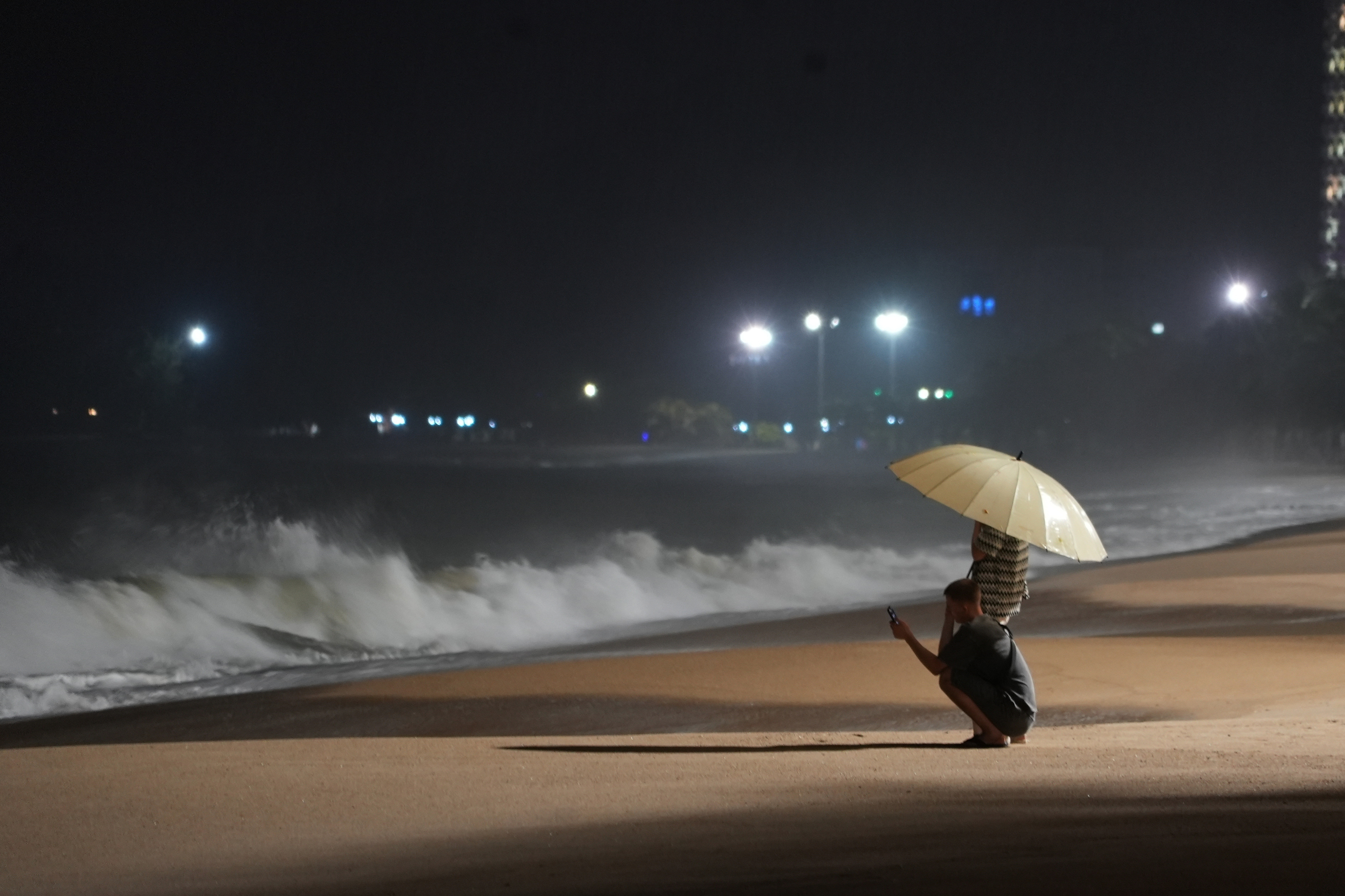 People watch rough waves caused by Typhoon Kalmaegi in Khanh Hoa, Vietnam on Thursday, November 6.