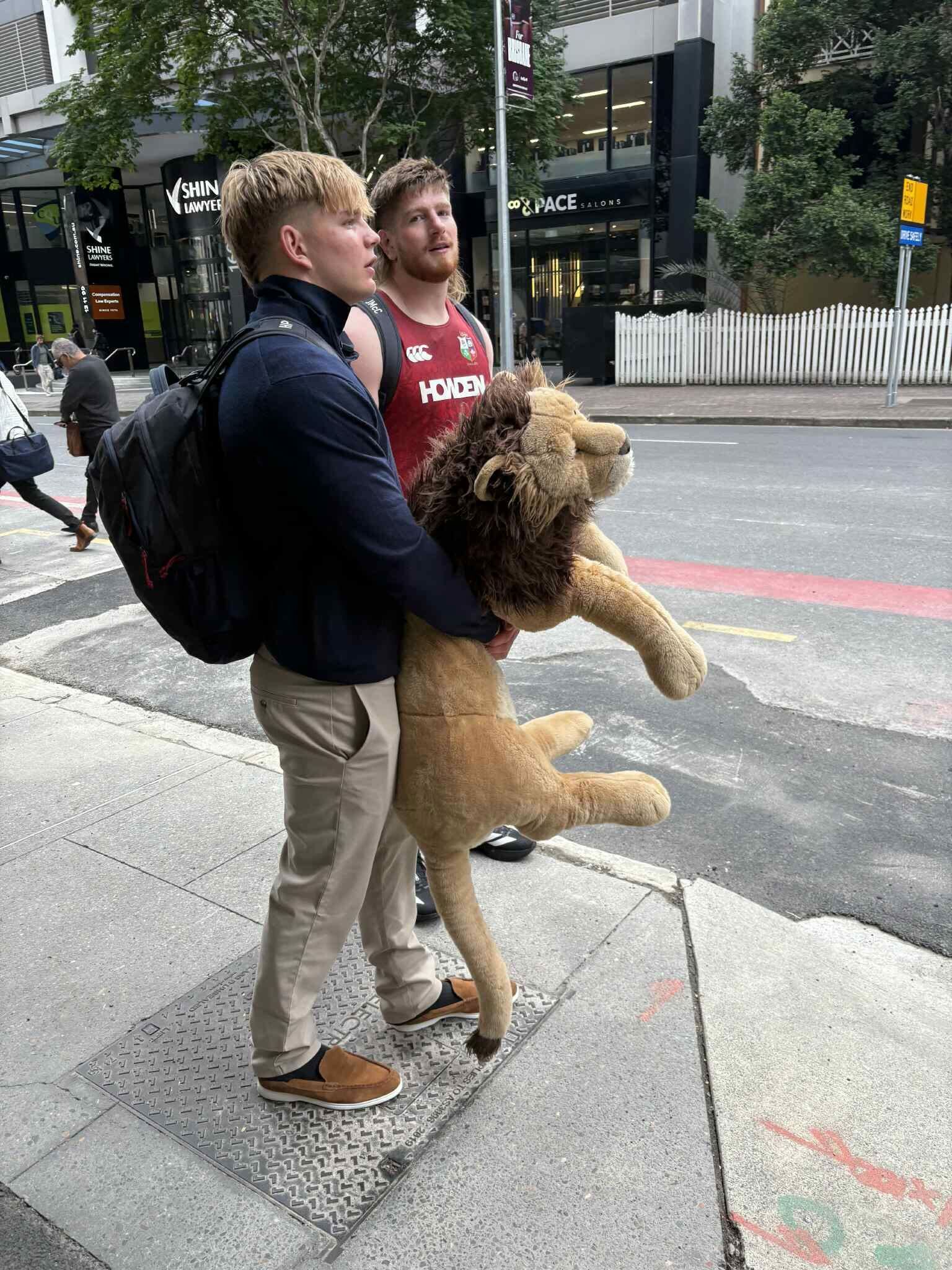 Henry Pollock takes 'BIL' the lion for a walk in Brisbane.