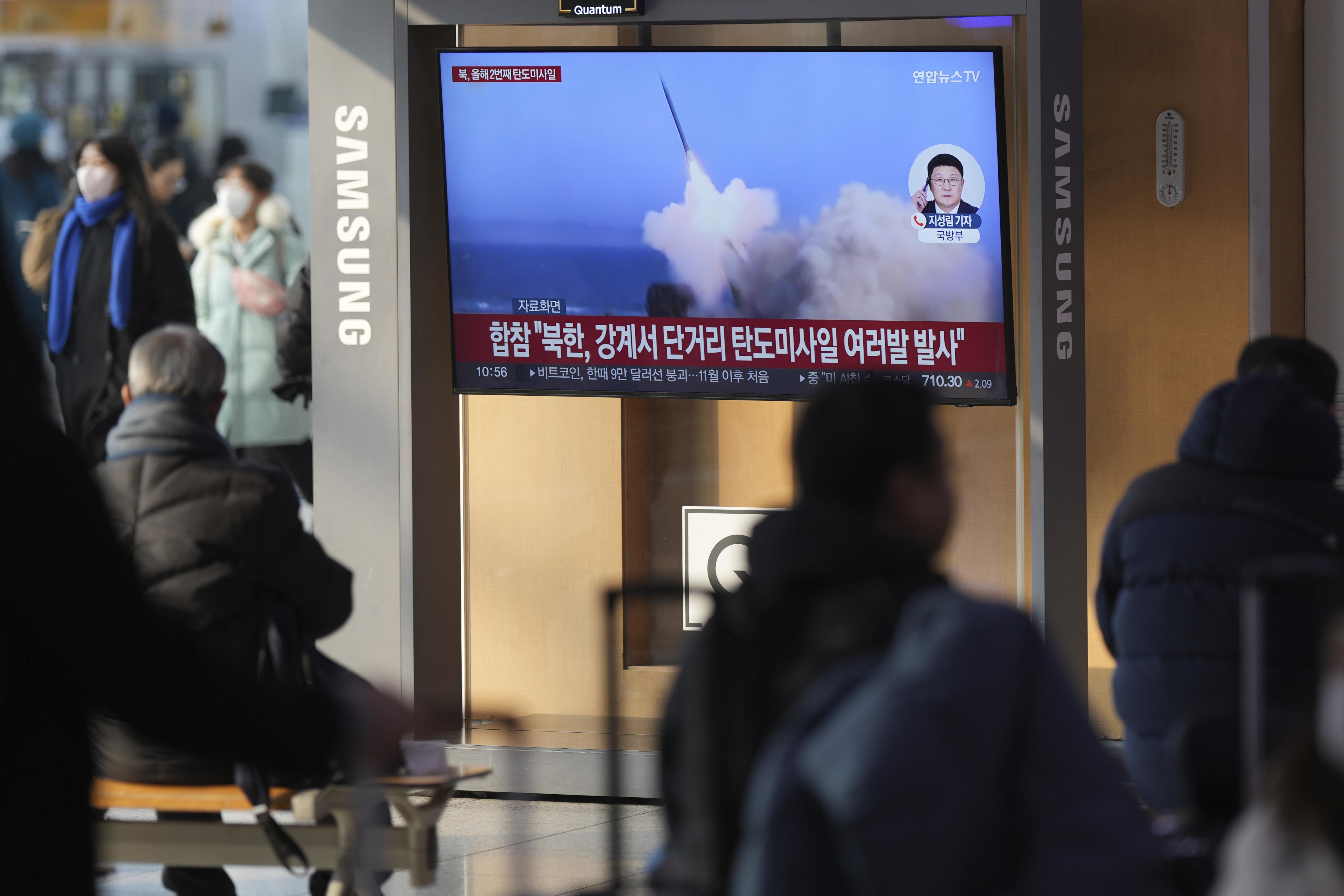 A TV screen shows a report of North Korea's missiles launch with file footage during a news program at the Seoul Railway Station in Seoul, South Korea.