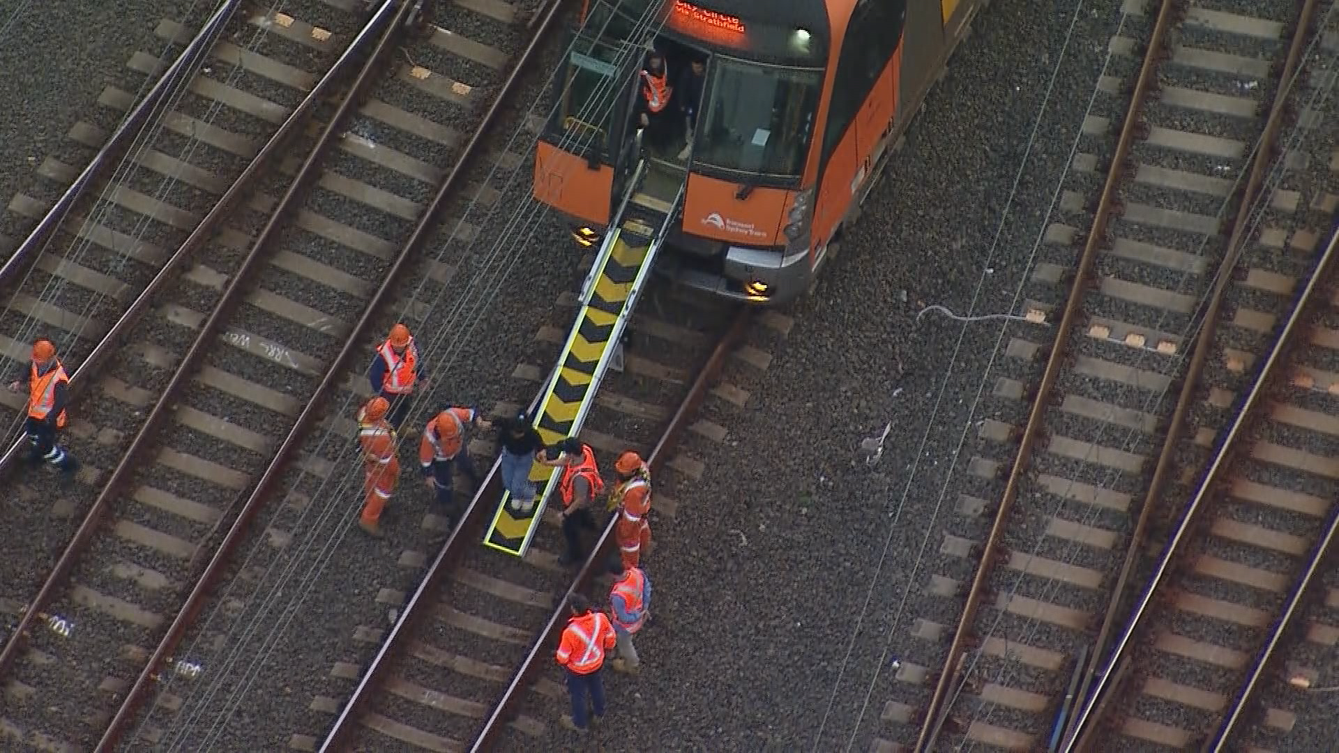 People being escorted from the train.